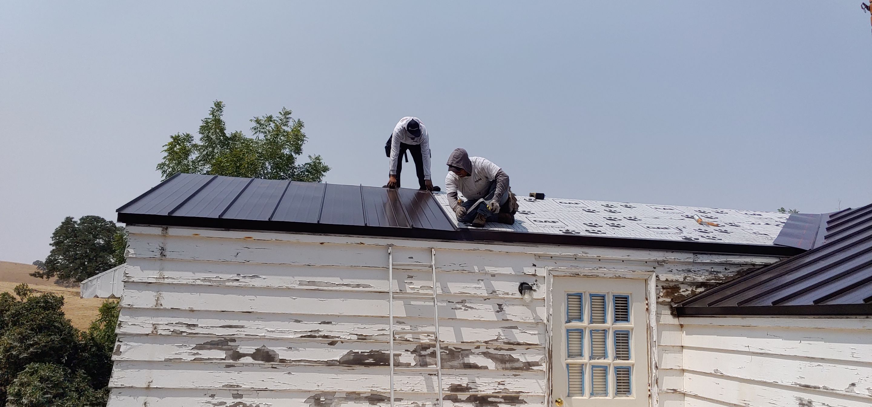 Residential Roofing Installation using Standing seam metal roofing system by Straight Edge Roofing Inc