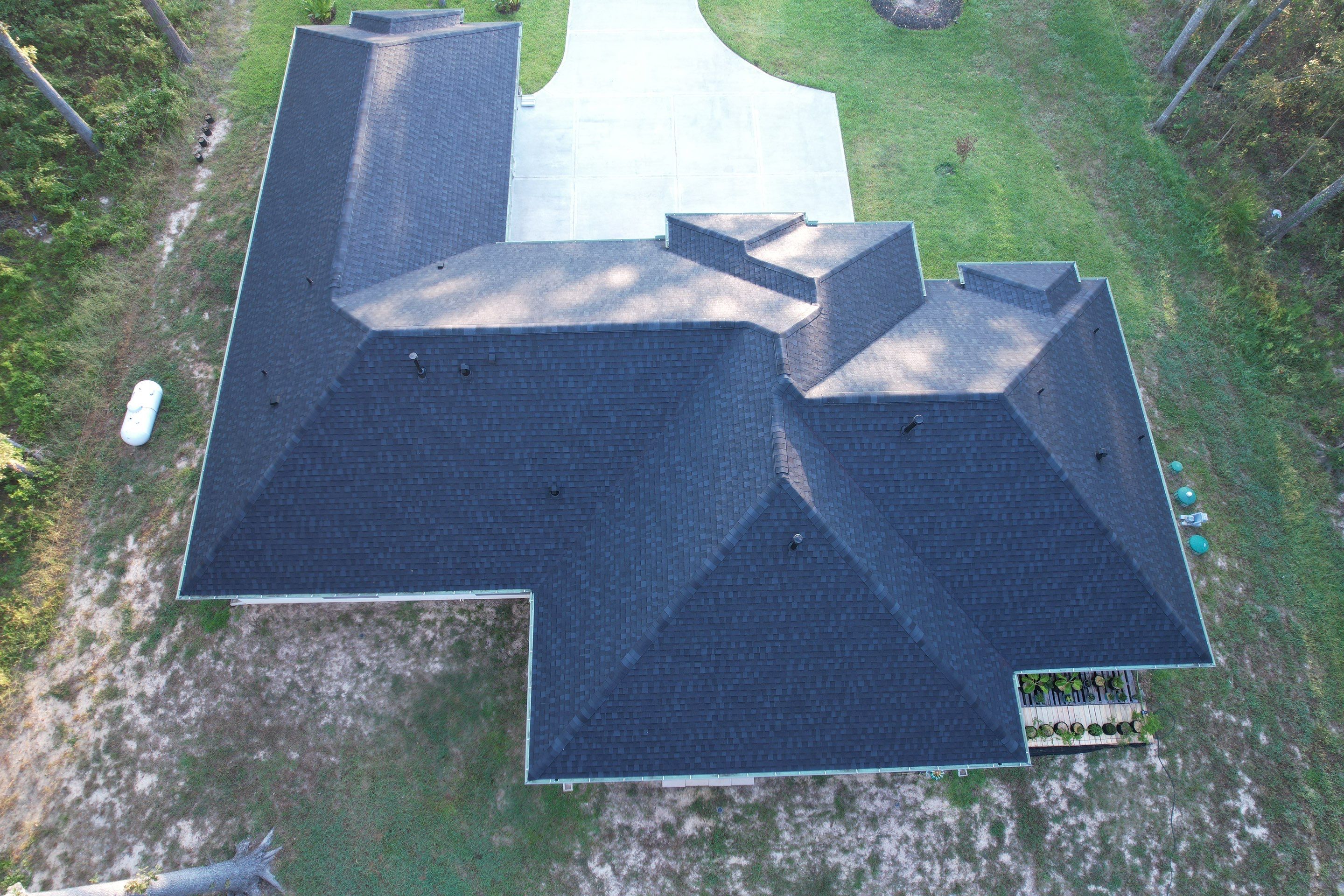 TAMKO Titan XT Rustic Black by STX Roofing