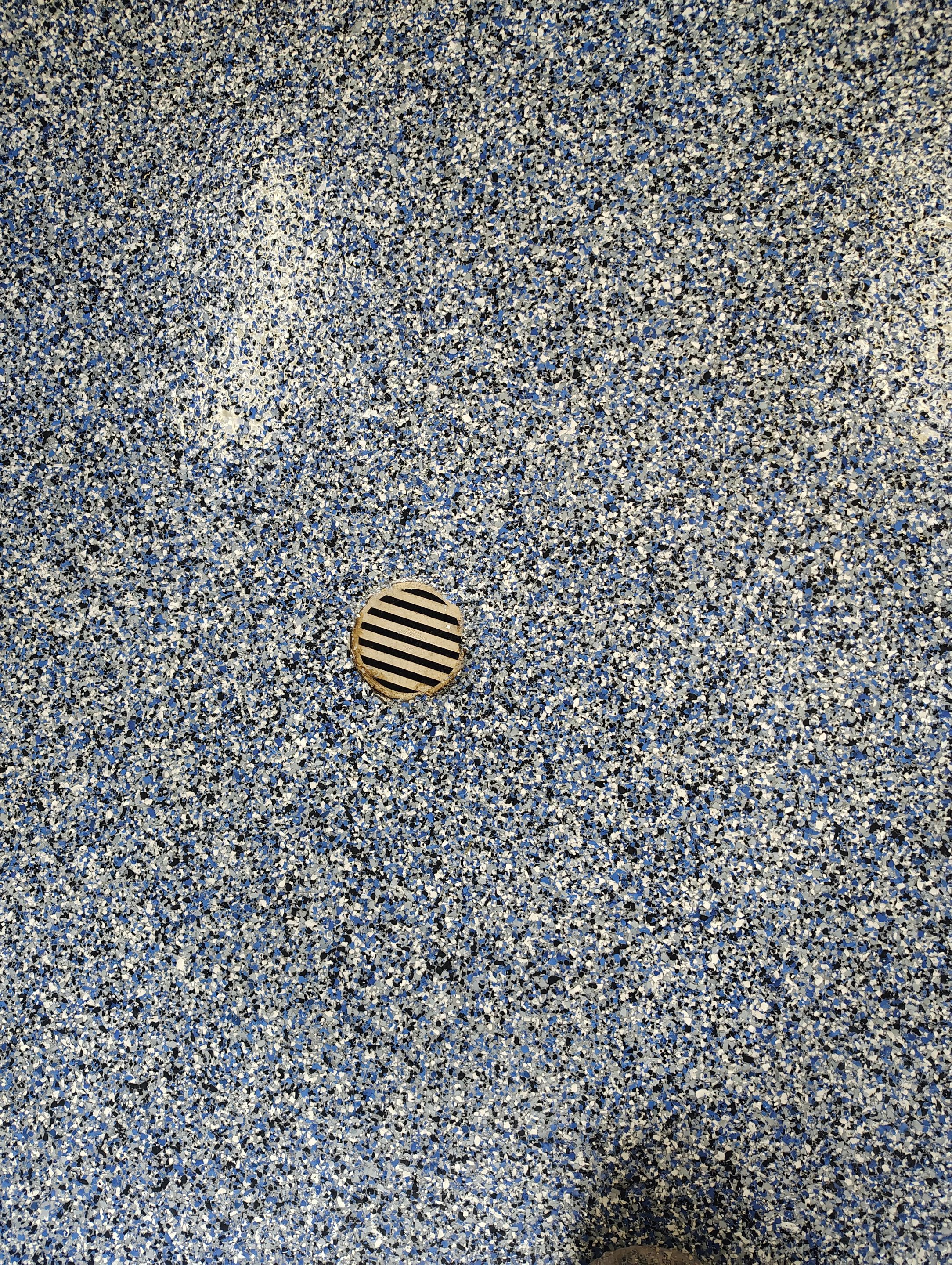 Custom Grey Flake Epoxy Garage Floor Installation in Remsen by Select Painting, Coatings & Garage Cabinets