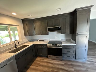 Modern Kitchen Remodel with Dark Brown Cabinetry in Fairfield
