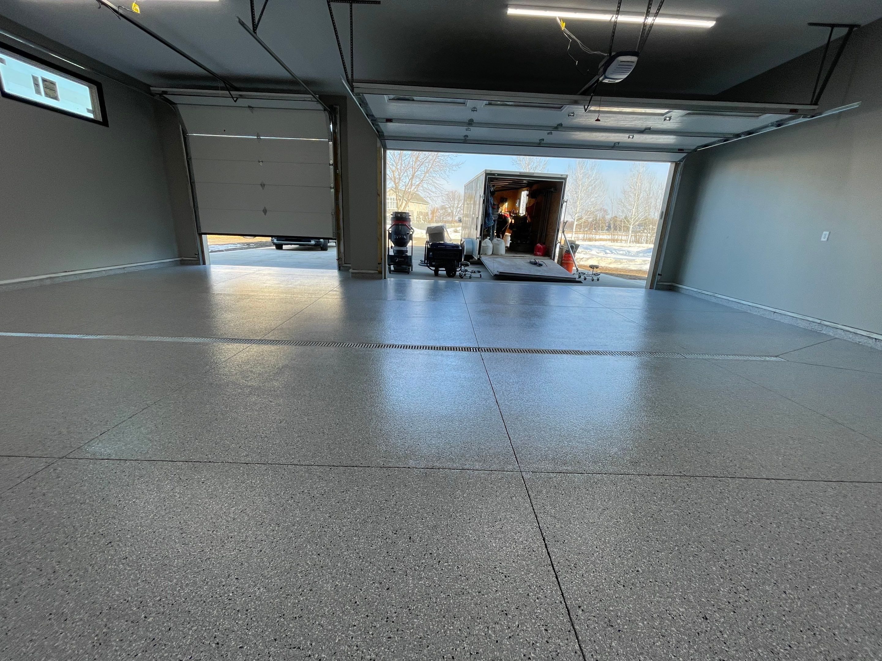 Decorative Flake Concrete Coating Installation in North Sioux City by Select Painting, Coatings & Garage Cabinets