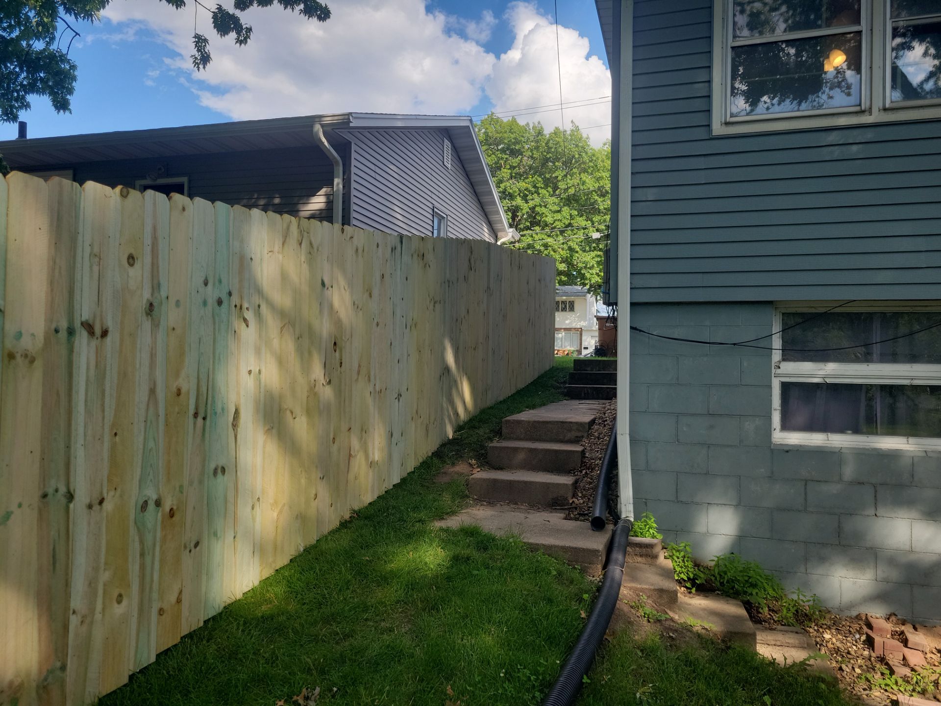 Pressure-Treated Pine Privacy Fence and Custom Gates in Waterloo by Perfect Picket Fence and Stain