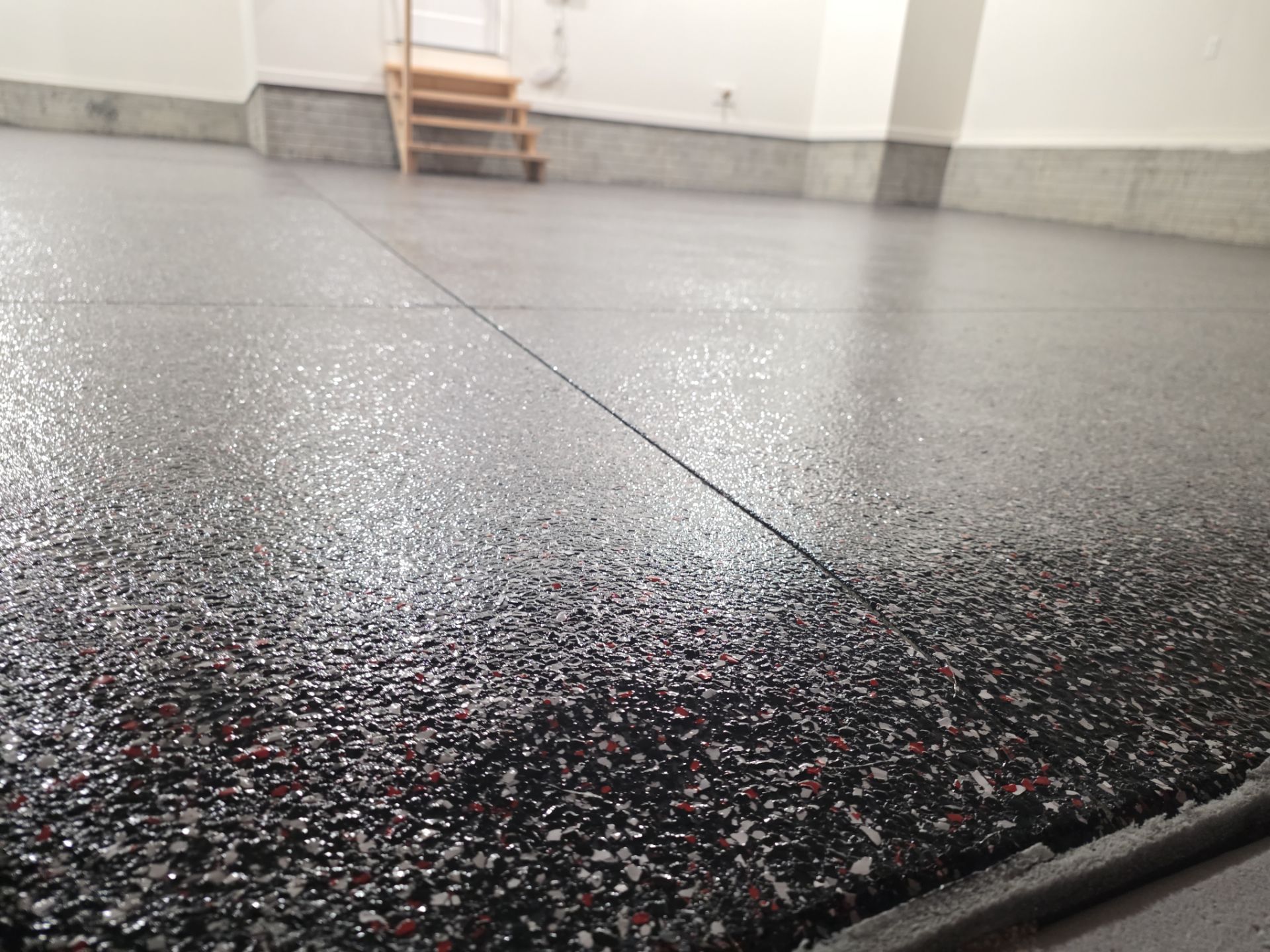 Husker-Style Garage by Revival Concrete Coatings