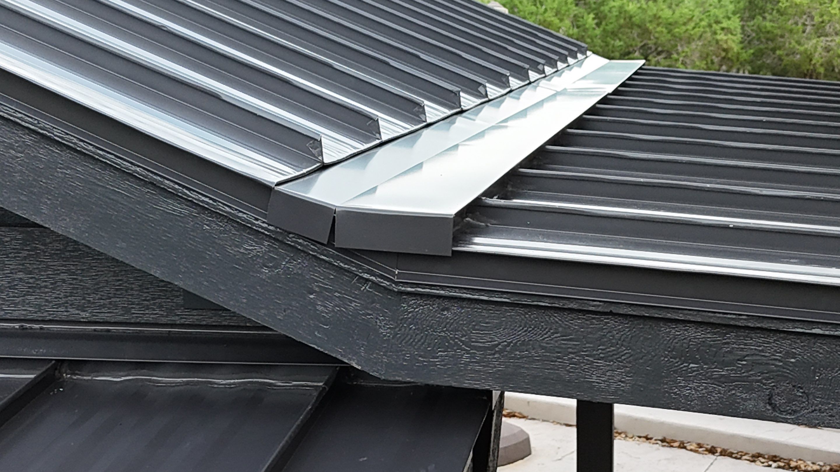 Dark Bronze Fully Striated panel by Wimberley Roofing