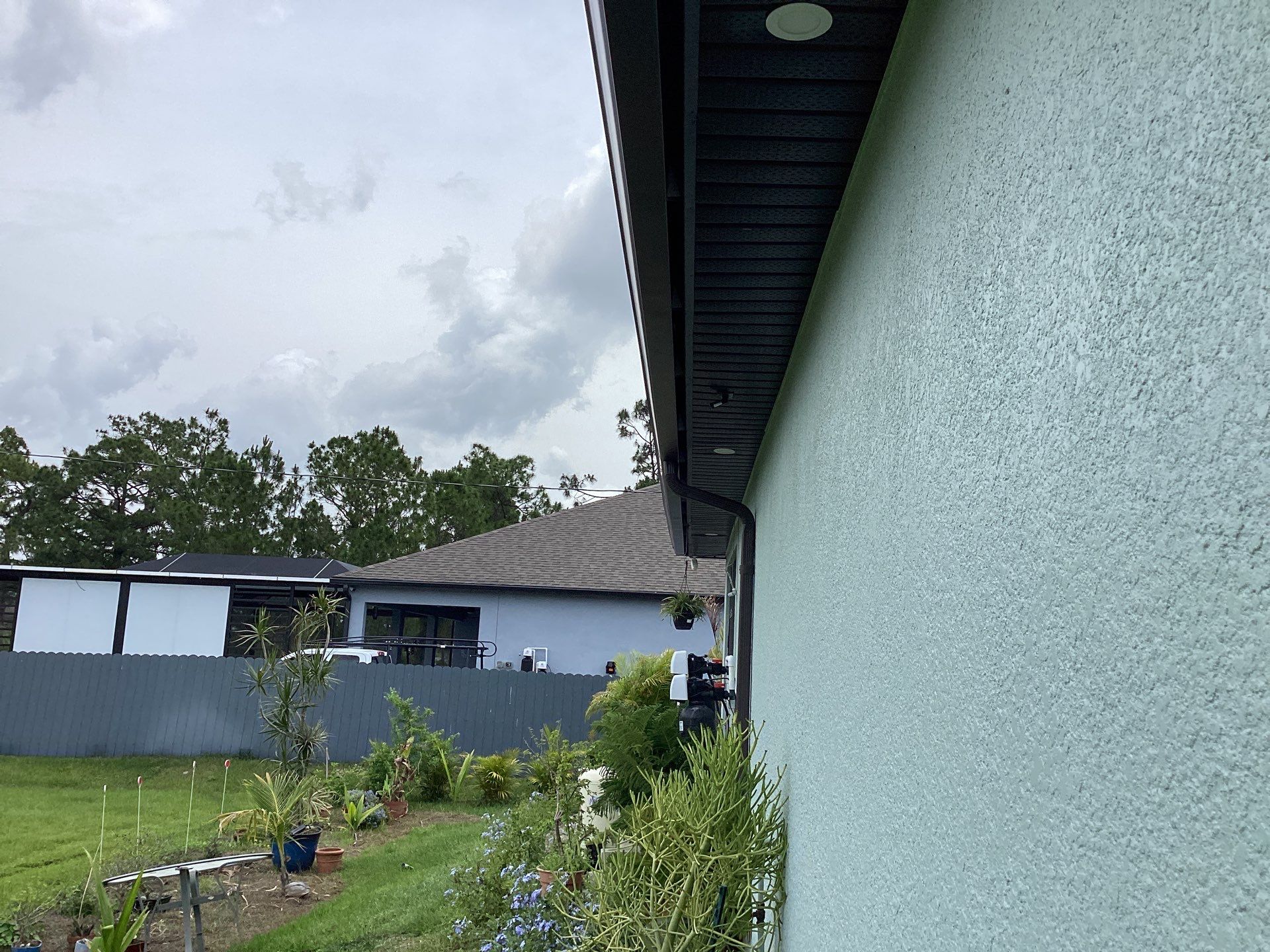 Musket Brown and New Downspouts in Lehigh Acres, FL  by Gutter Professors