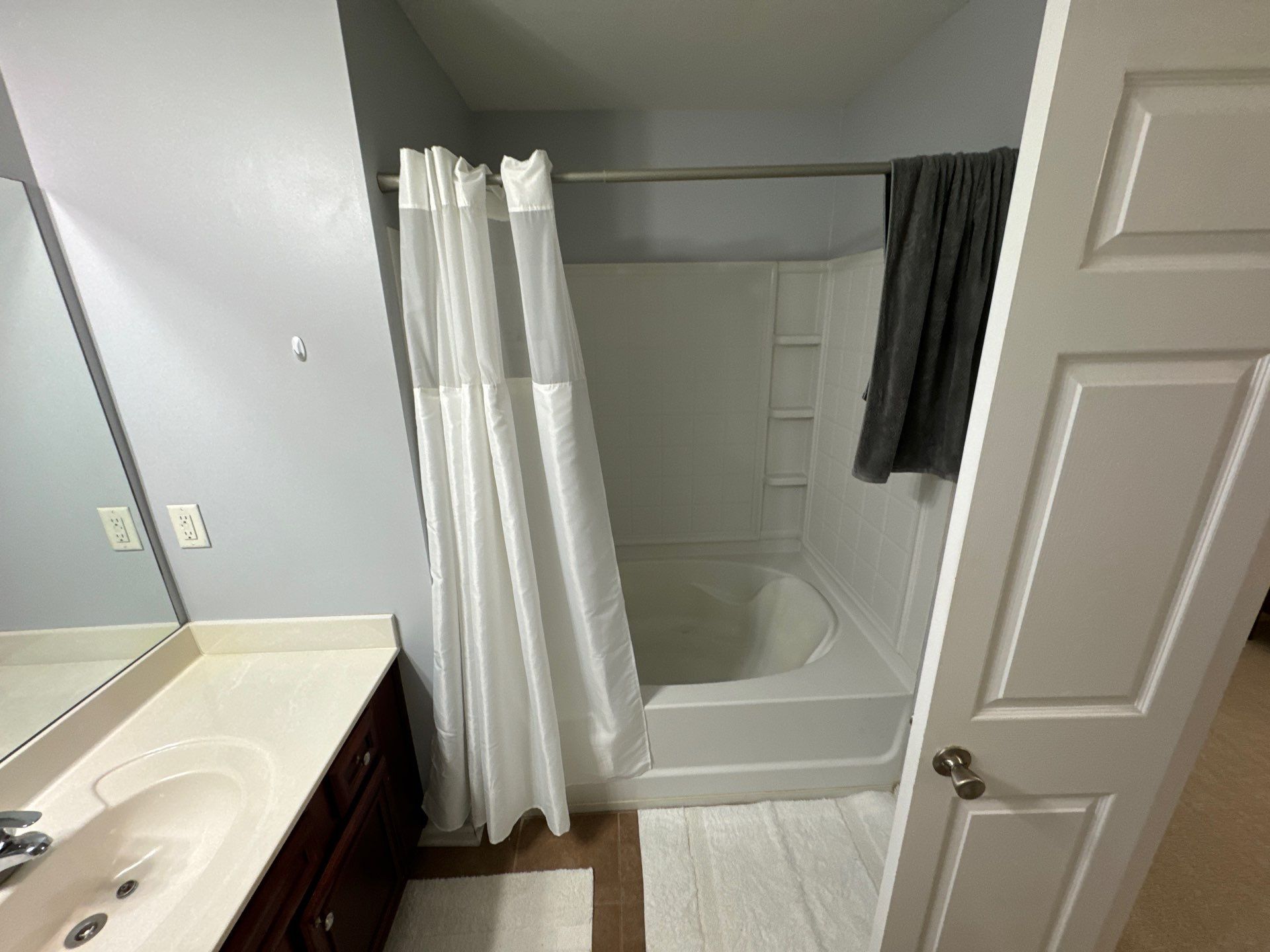 Tub to walk-in shower conversion, and tile flooring by Prudencio