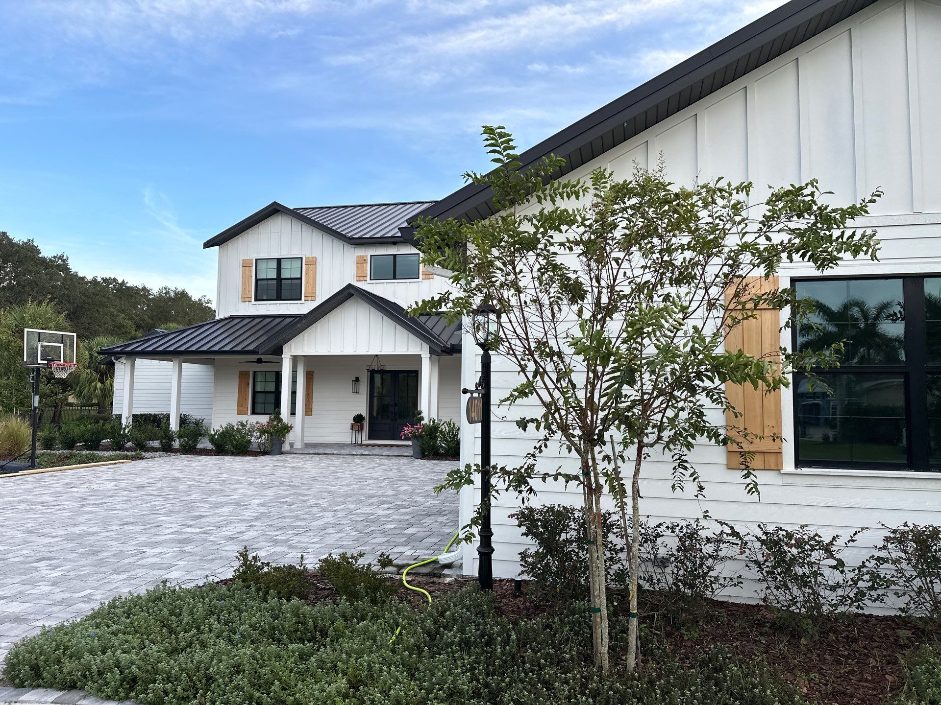 Complete Two-Story House Wash and Driveway Cleaning in Winding River Community, Bradenton, FL by Sunshine AquaWash