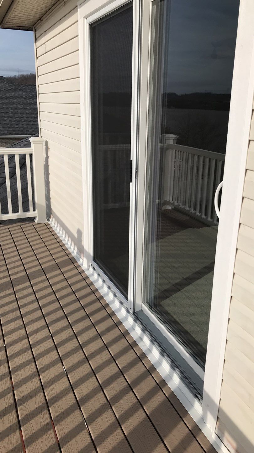Deck Refurbush and Door Replacement using Trex Decking and Railing. Polaris Patio Doors by Secure Construction Company Inc