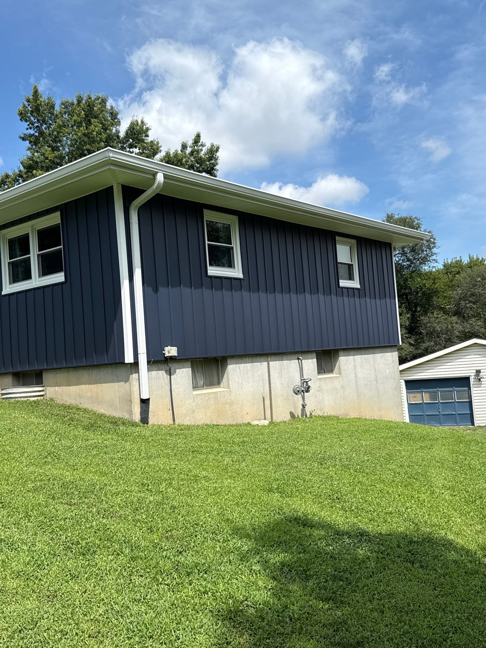 Indigo Board and Batten Siding and Window Replacement in Smithville by EEC Windows, Siding & Roofing