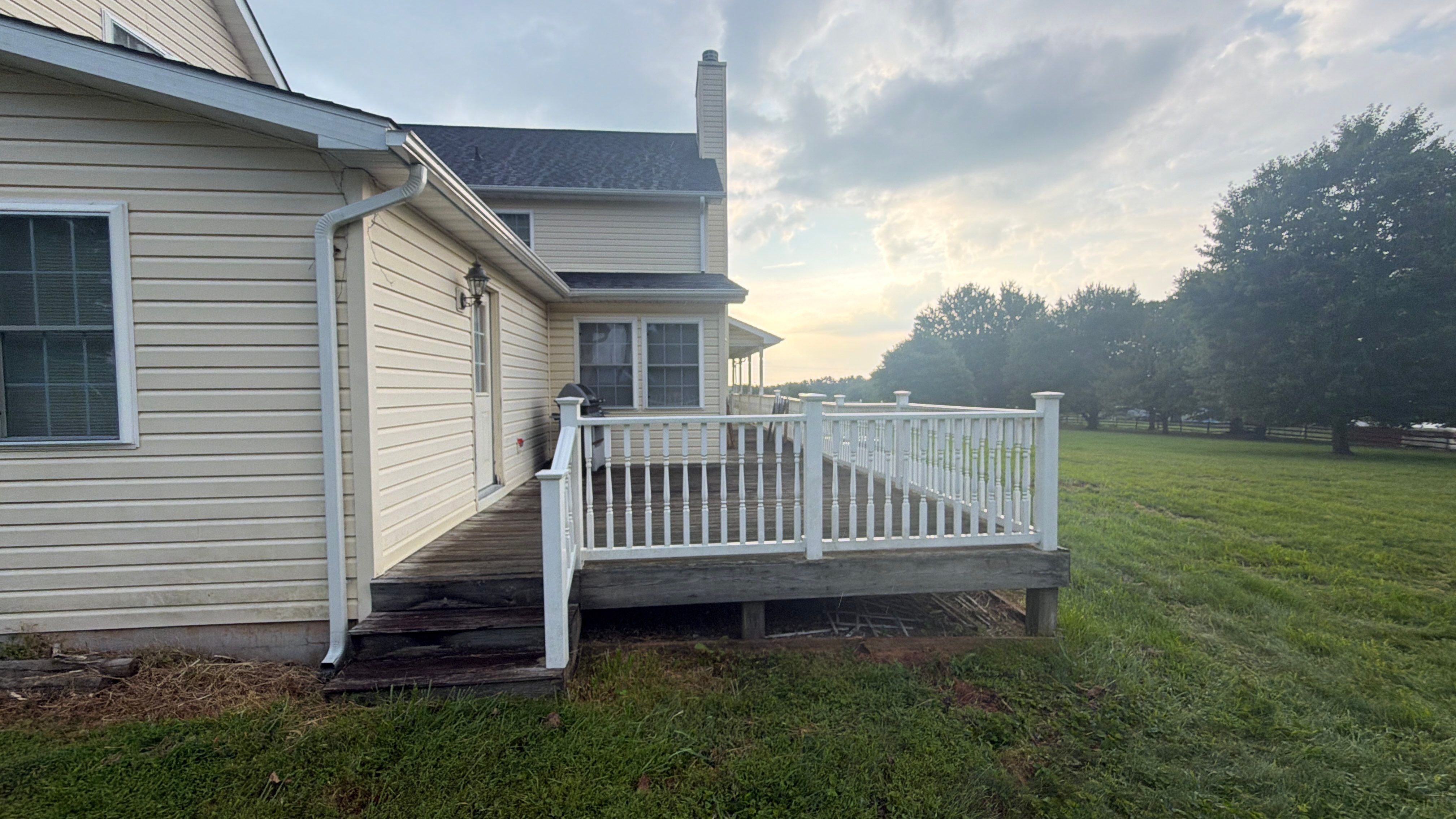 Vinyl Siding House Washing and Wood Deck Restoration in Carroll County by Baltimore Pressure Washers Inc.