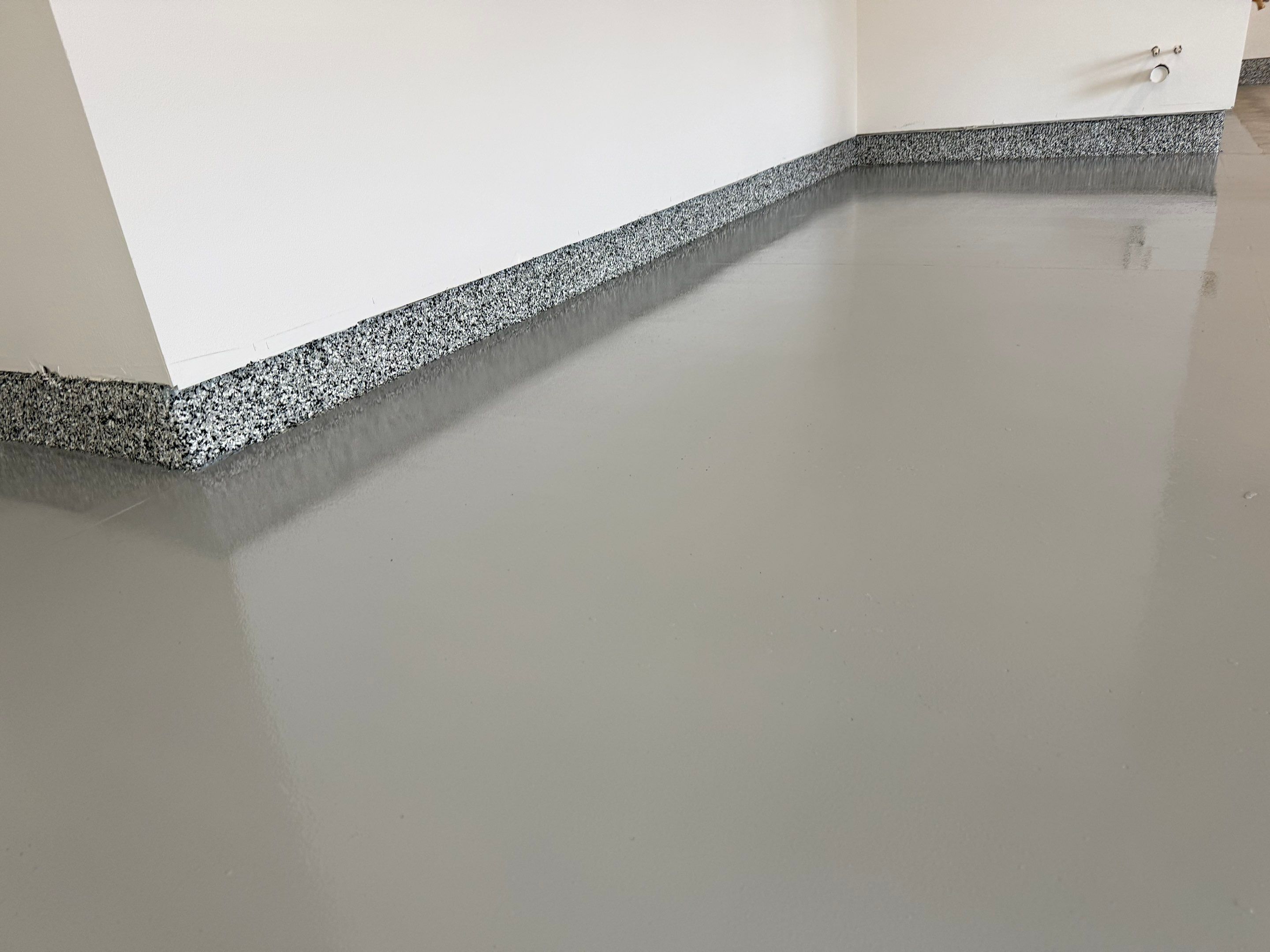 Multi-Car Garage Epoxy Floor Coating and Concrete Finishing in Sioux Falls by Select Painting, Coatings & Garage Cabinets