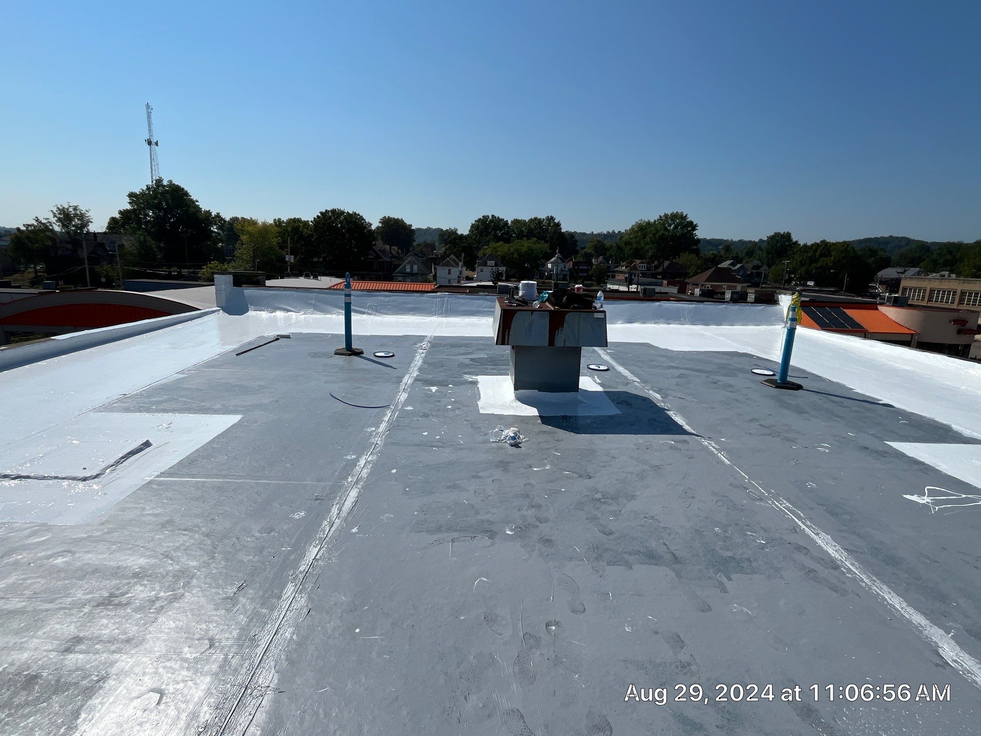 Commercial Roofing Installation using smartcoat Roof coating by Fahey Roofing + Contracting