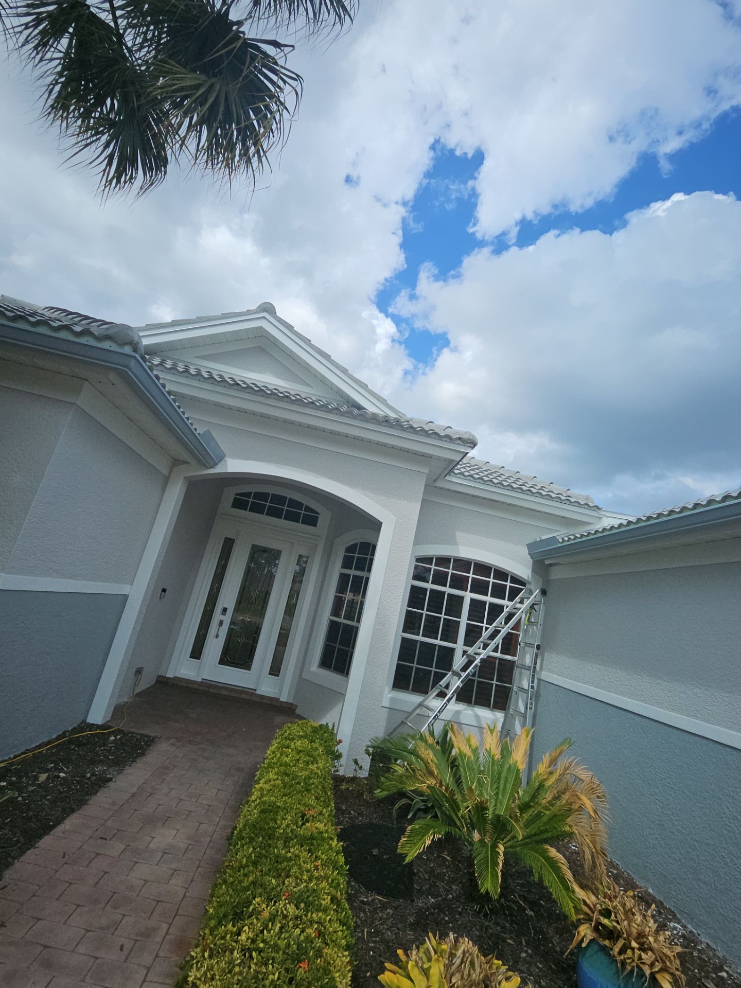 6-inch K-style Seamless Gutters and Splash Guard in Grey Color in Naples FL by Gutter Professors