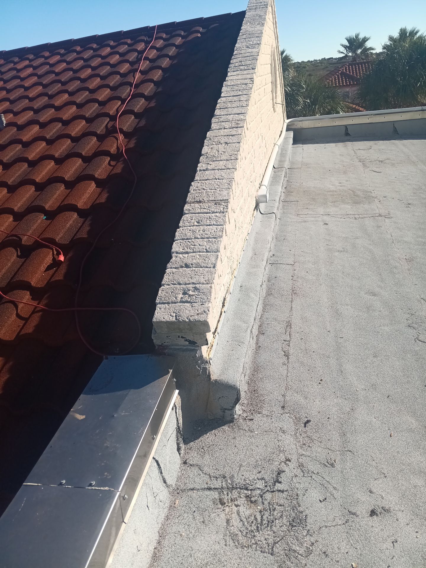 Off with the Tile and on with the TILCOR stone coated metal.  by Bayfront Roofing and Construction