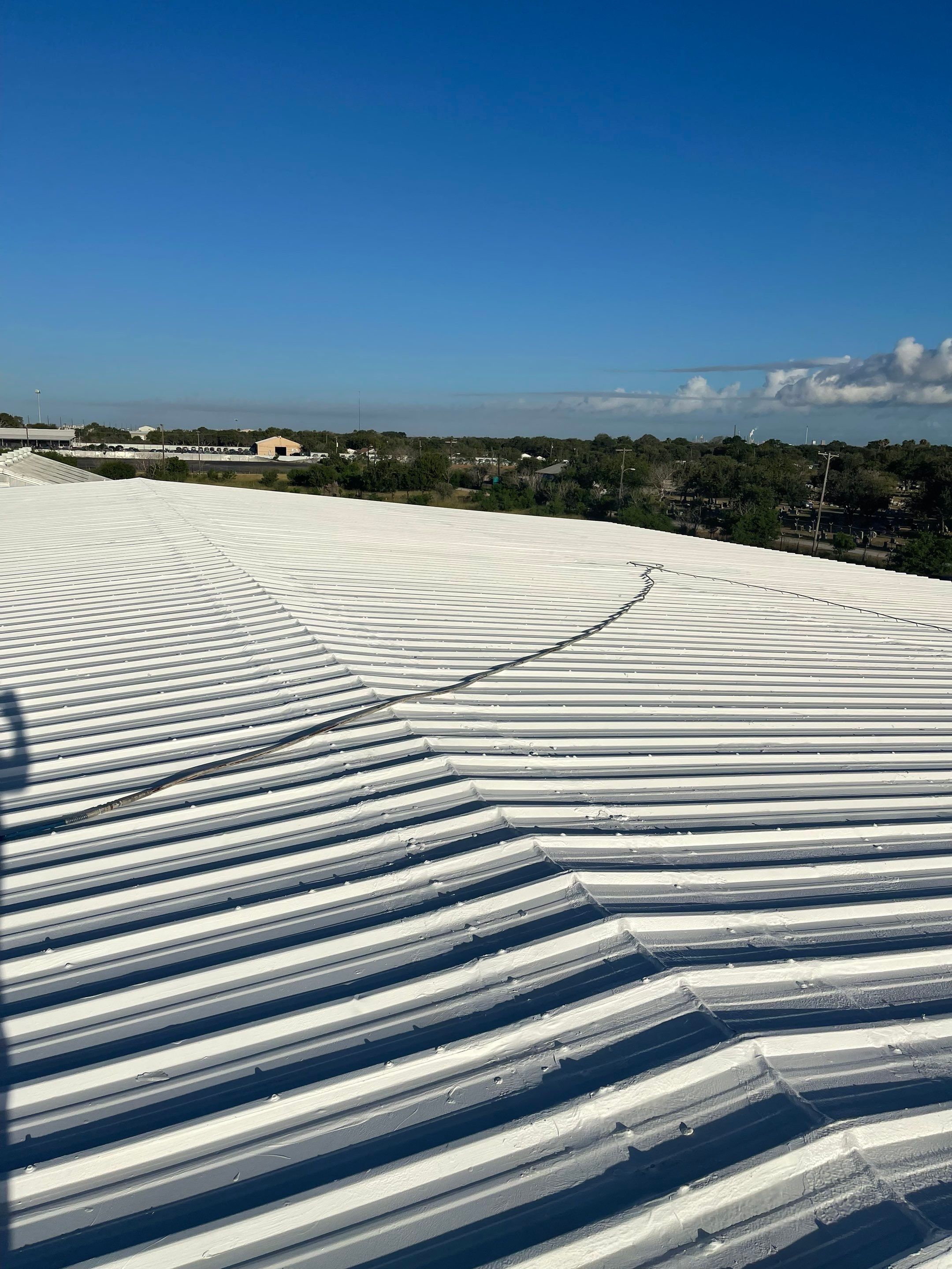 Commercial Roofing Installation using GAF 10 Year Acrylic System by Lighthouse Roofing