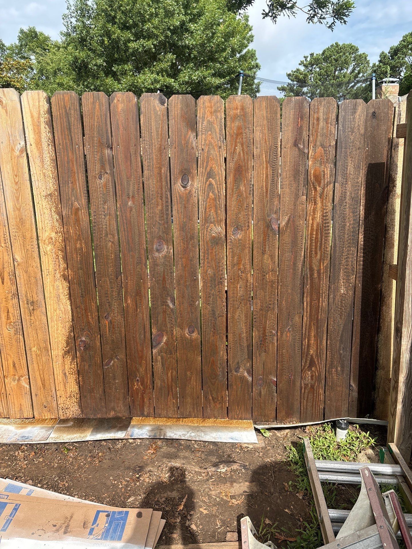 Project in TylerExterior Painting in Tyler, TX | White Brick Home, Varnished Fence & Shed Painting by Quality Coats Painting