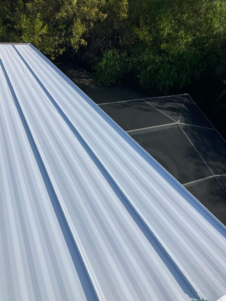 Residential Roofing Installation using Gulf Coast Metals Gulf Seam Panels by Four Peaks Roofing