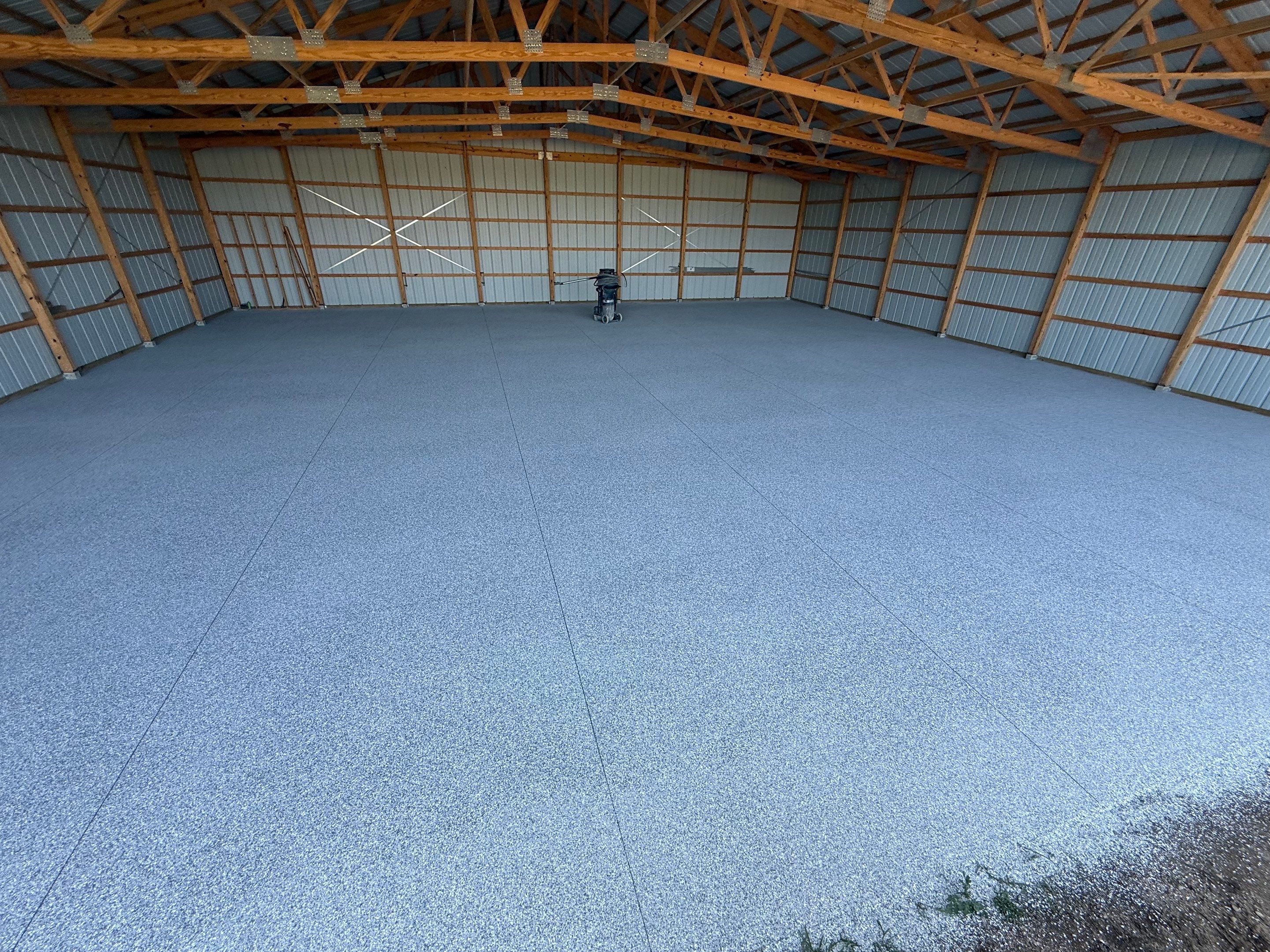 Durable Grey Speckled Epoxy Floor Coating for Yankton Shop by Select Painting, Coatings & Garage Cabinets