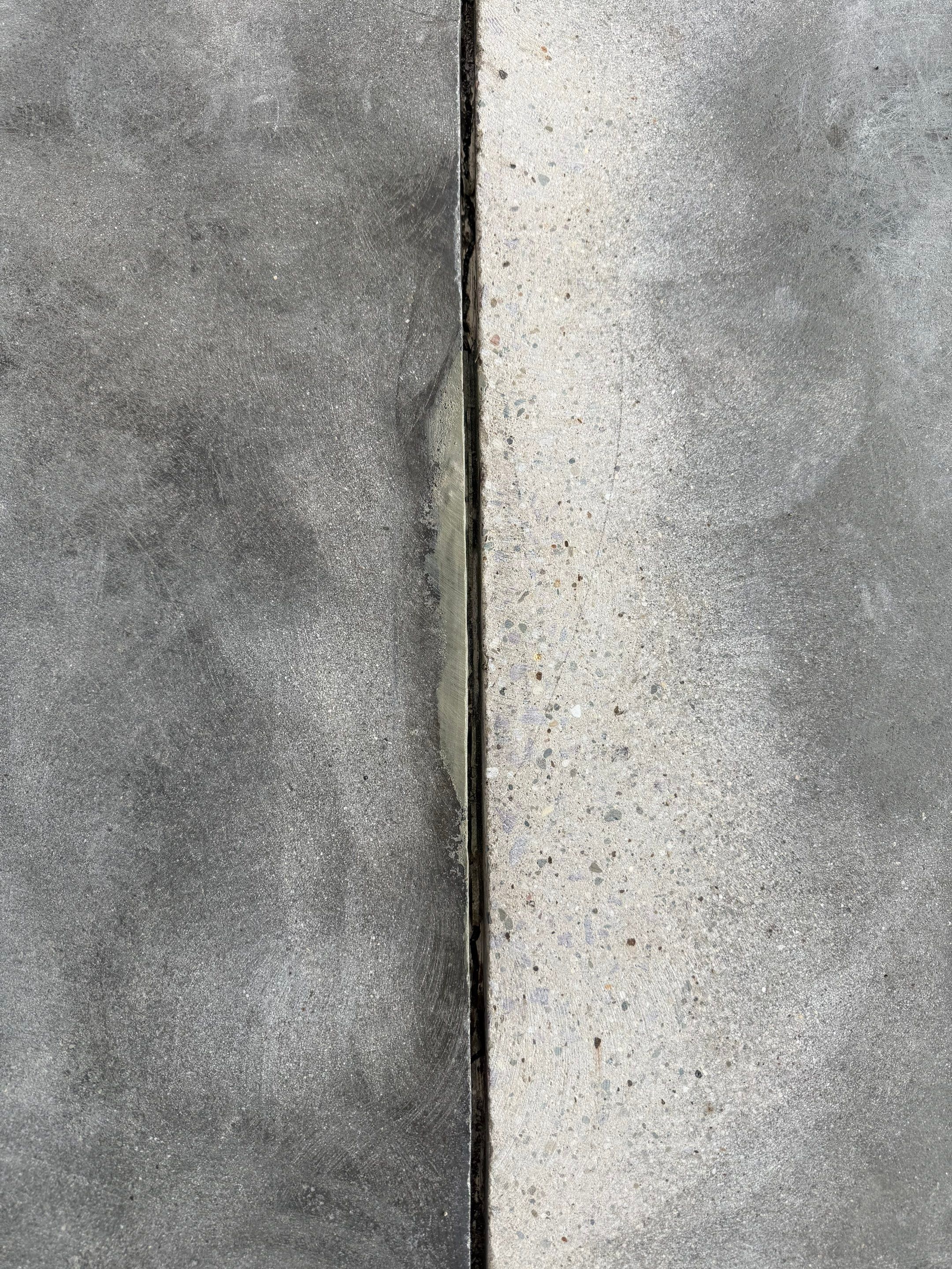 Feather Gray Epoxy Floor Coating Installation in Sioux Falls by Select Painting, Coatings & Garage Cabinets