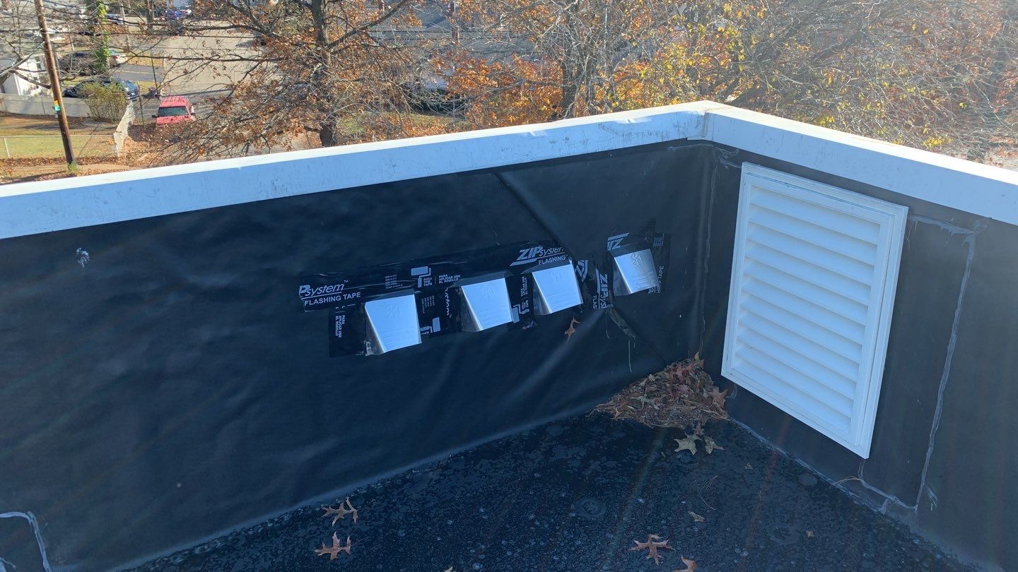 Commercial Roofing Installation using EPDM with white gutters by A Plus Exterior