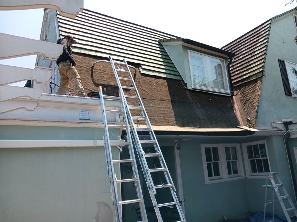 Slate removal/Cedar Shake replacement by Storm Contracting 