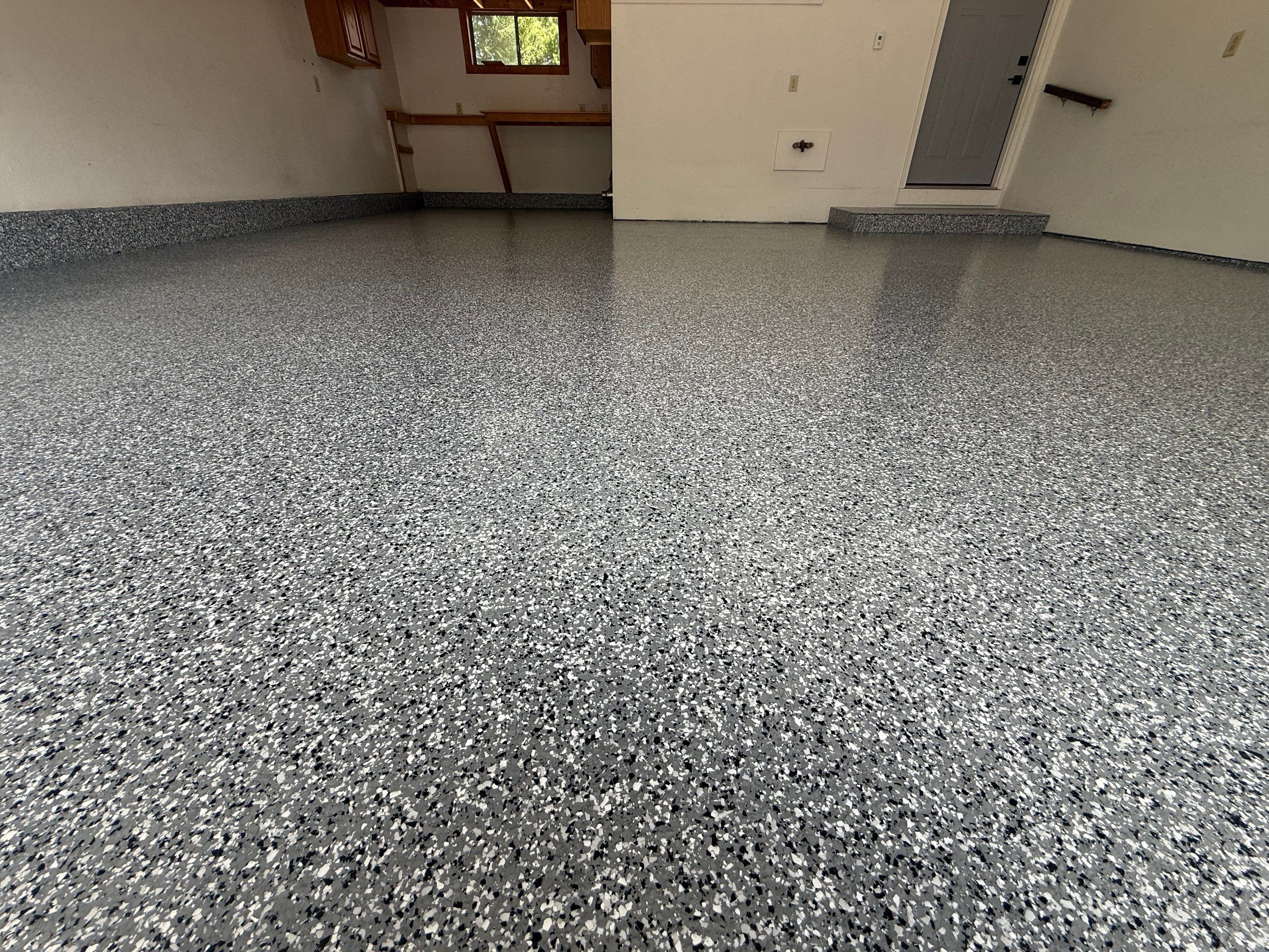 Smoke Flake Garage Floor Coating in Dell Rapids by Select Painting, Coatings & Garage Cabinets