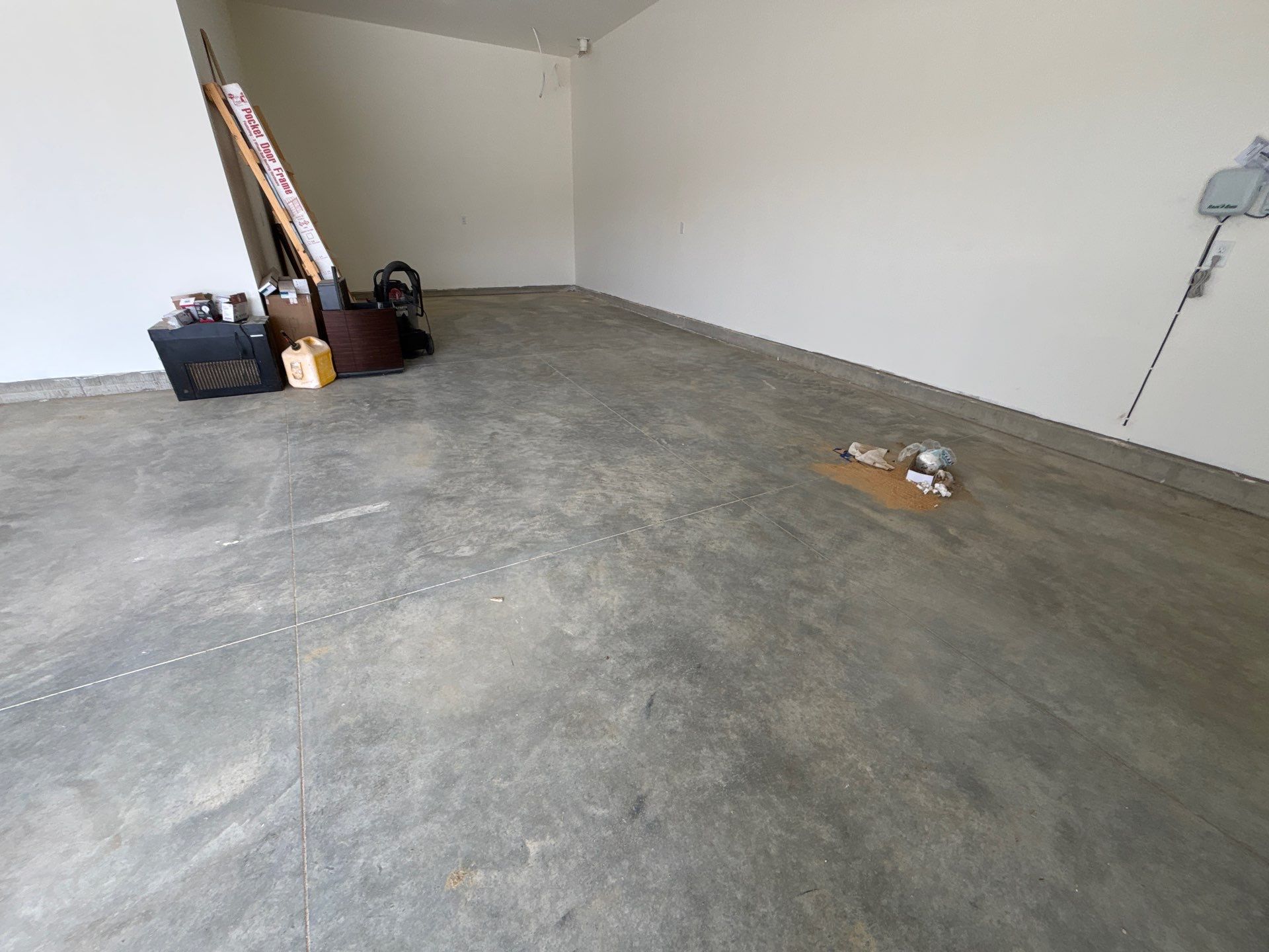 Sioux Falls Garage Floor Transformation with Gray Decorative Flake Coating by Select Painting, Coatings & Garage Cabinets