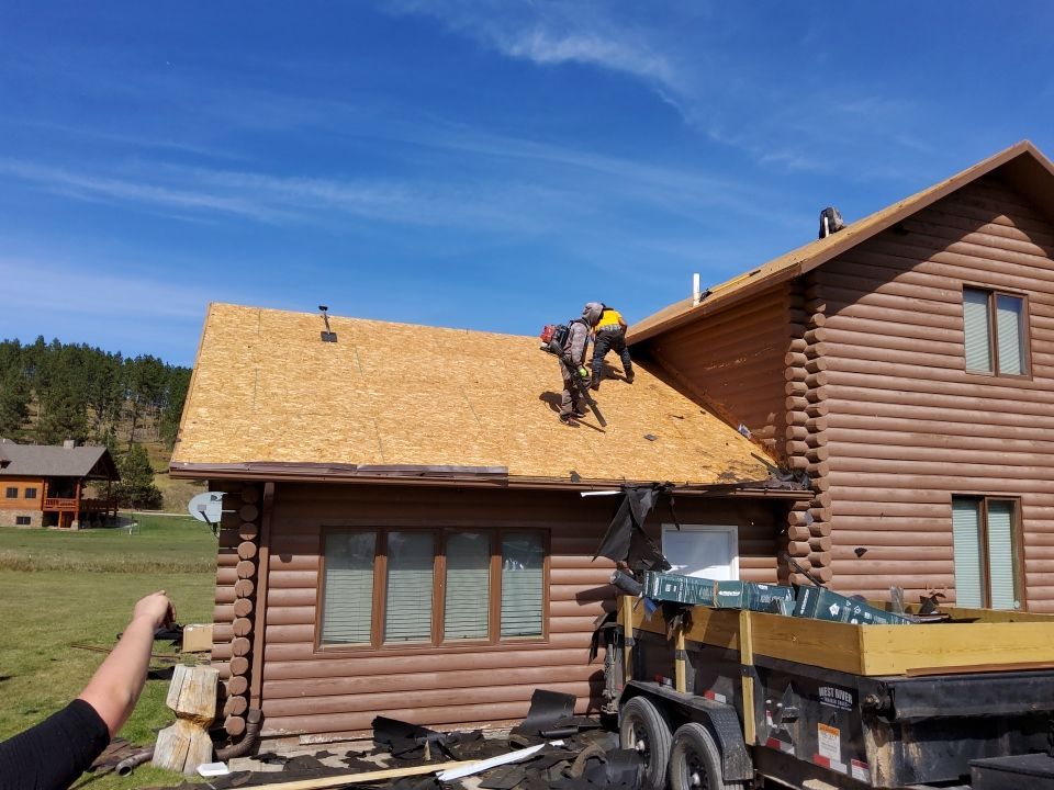 Hill Country Guest Ranch using Steel Roofing, Gutters, Log Cabin Staining by Lightning Exteriors