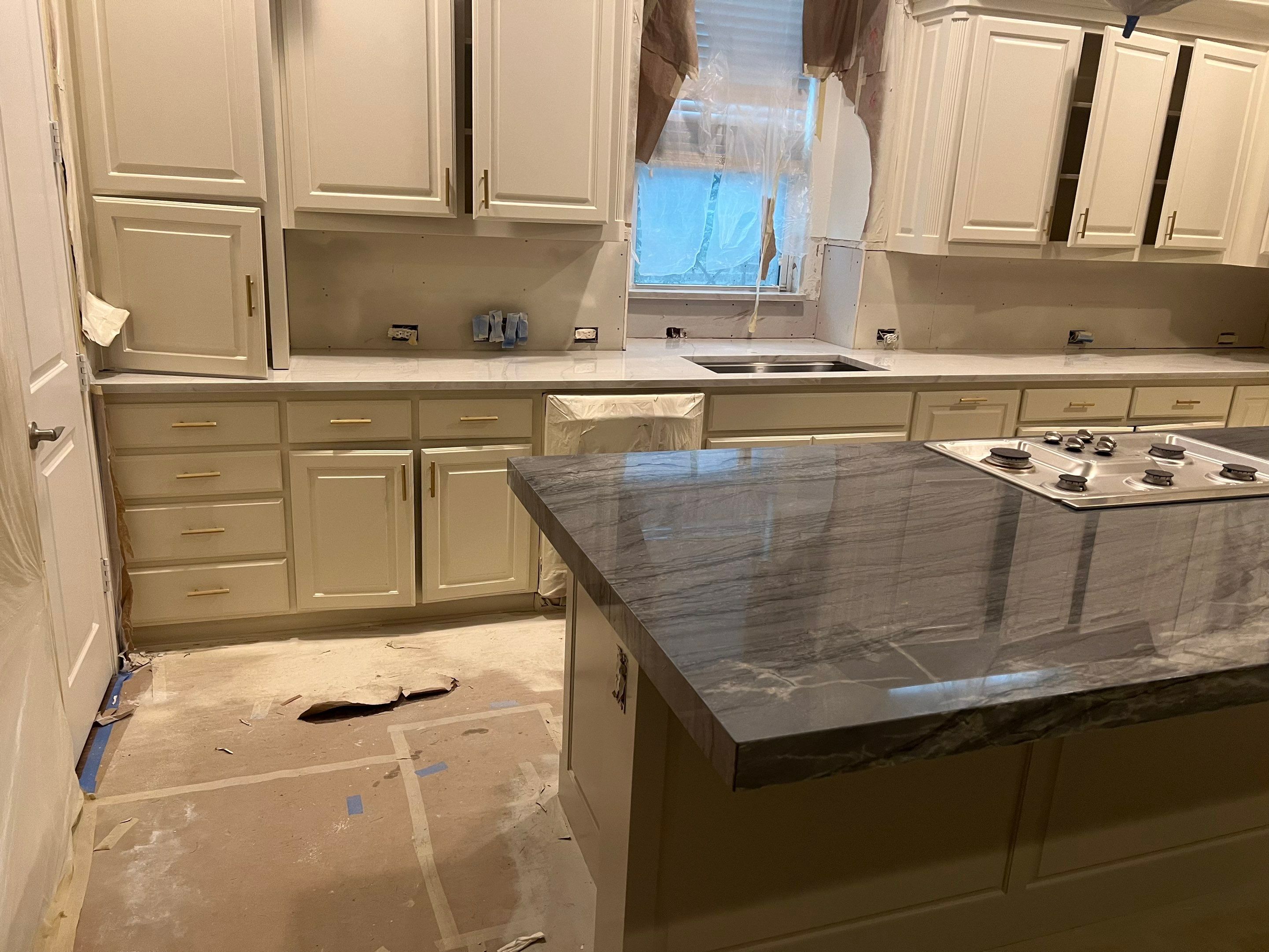 Kitchen Remodel using Quartzite by SLM General Contractors & Roofing