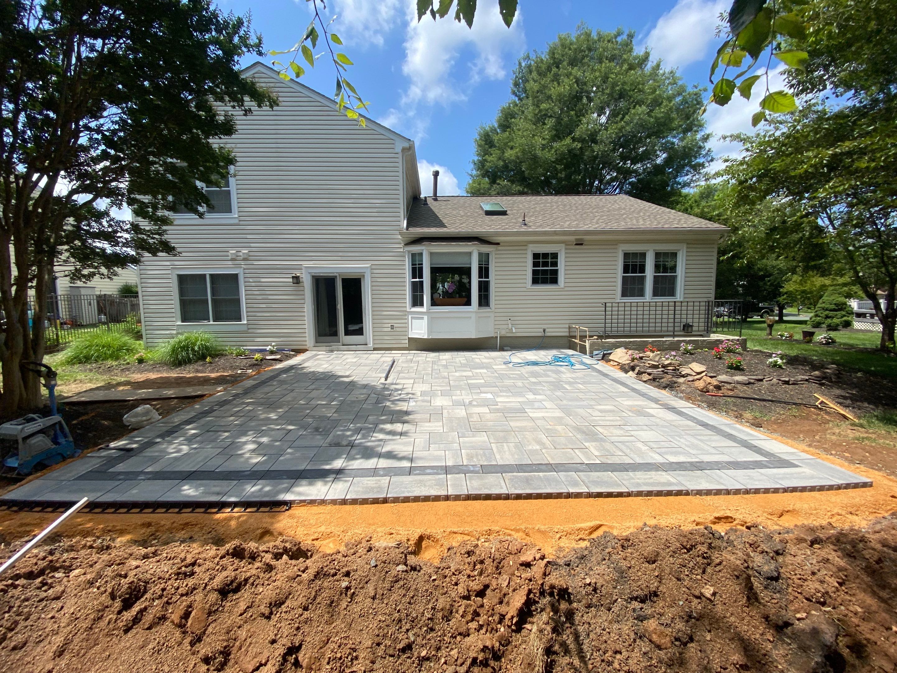 Backyard Transformation using Techo-Bloc Pavers by The Smet Companies, LLC