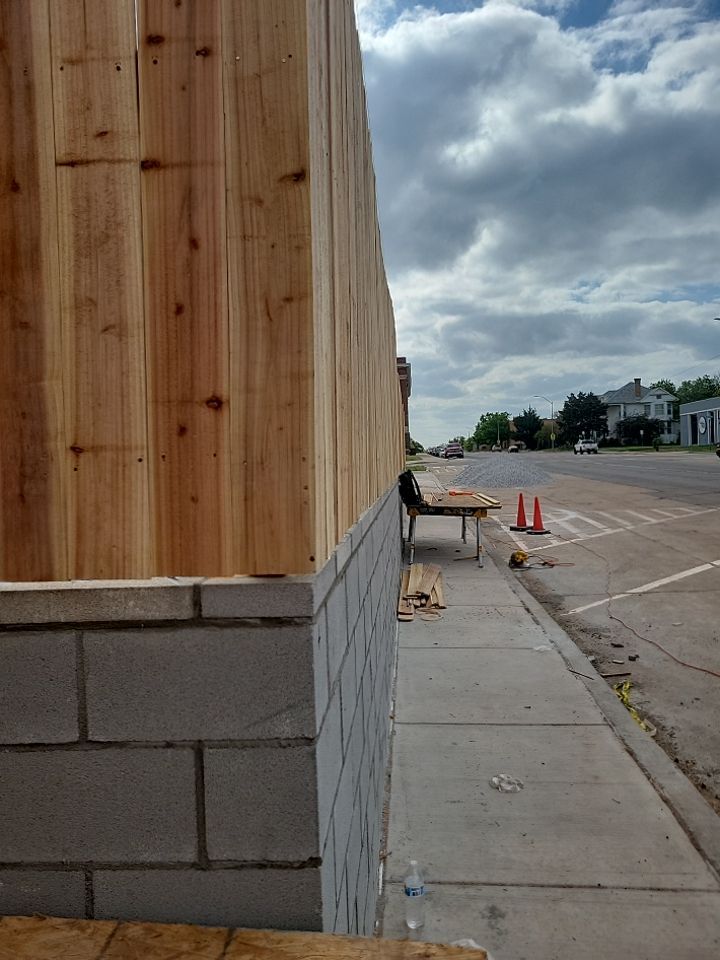 Cedar Fence using Cedar Pickets and Metal Poles by Clays Services Inc