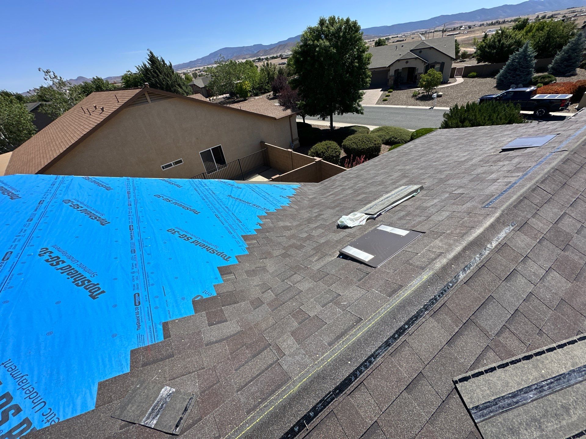 Residential Roofing Installation with Architectural Shingles and Turret Detail by Badger Roofing