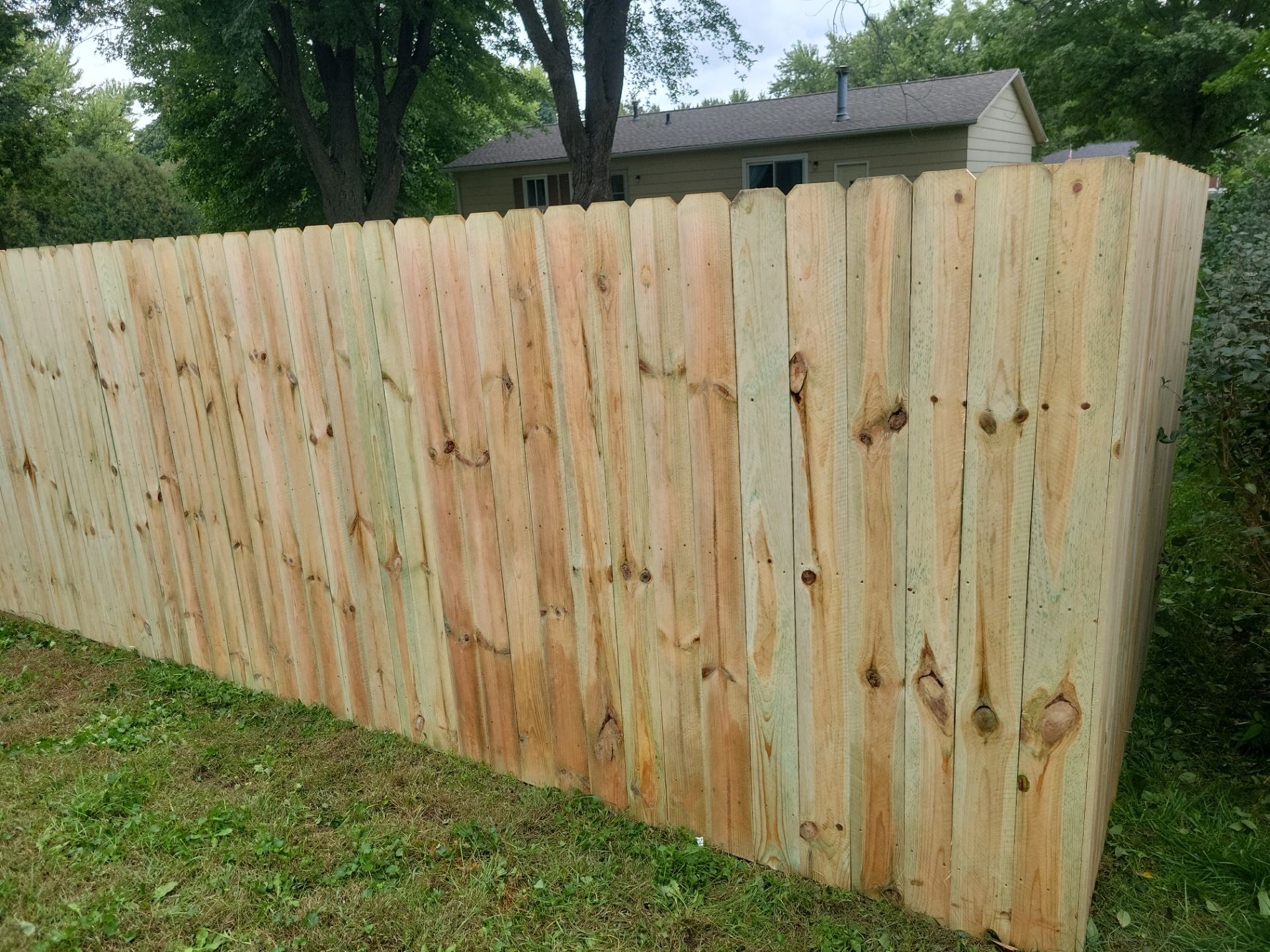 Pressure-Treated Wood Privacy Fence Installation in Waverly by Perfect Picket Fence and Stain