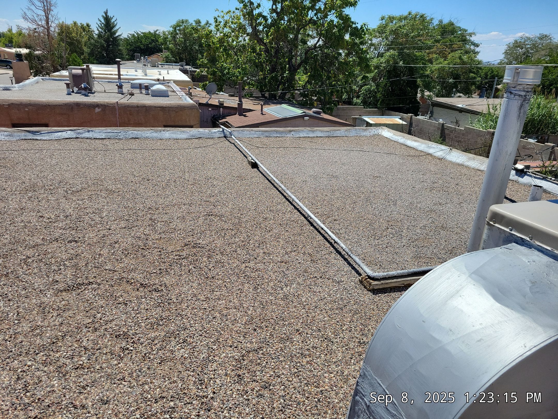 Albuquerque Flat Roof Replacement Using Tan Modified Bitumen Membrane by Doyle Roof Masters Inc