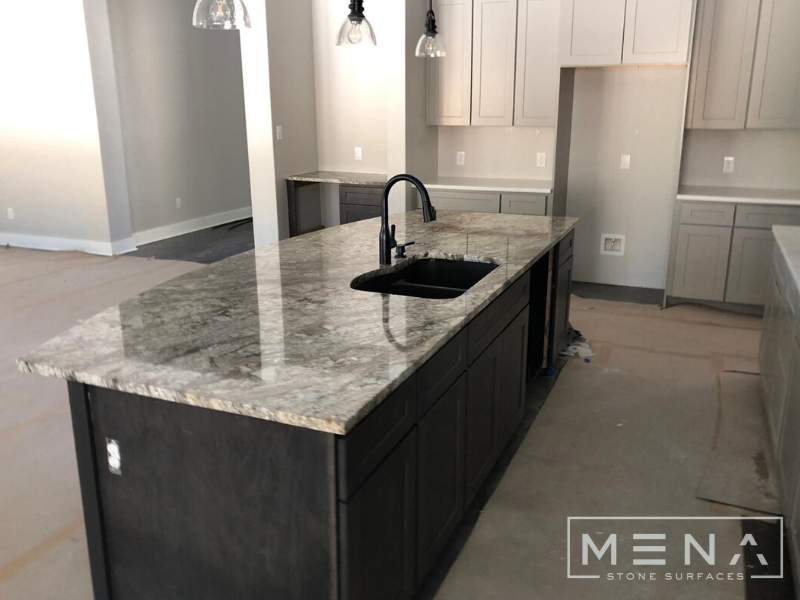 Kitchen countertops using Blue Dunes Granite by Mena stone surfaces