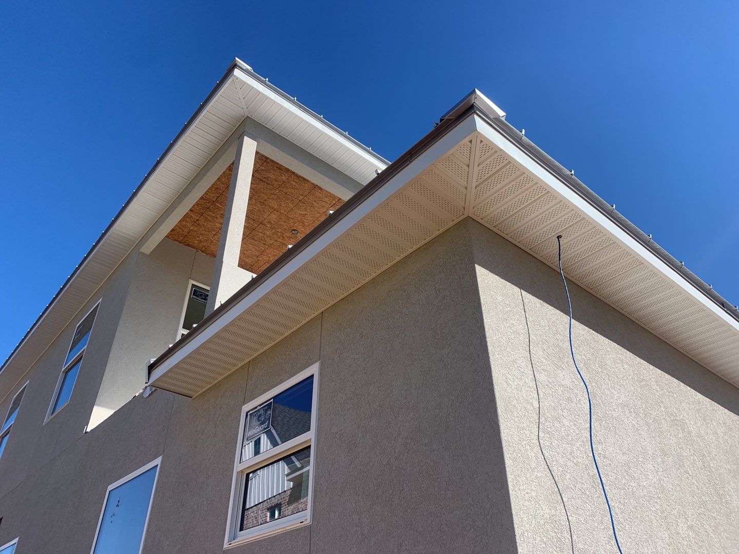 Soffit and Fascia Installation using White Vinyl Soffit in Pensacola FL by Gutter Professors