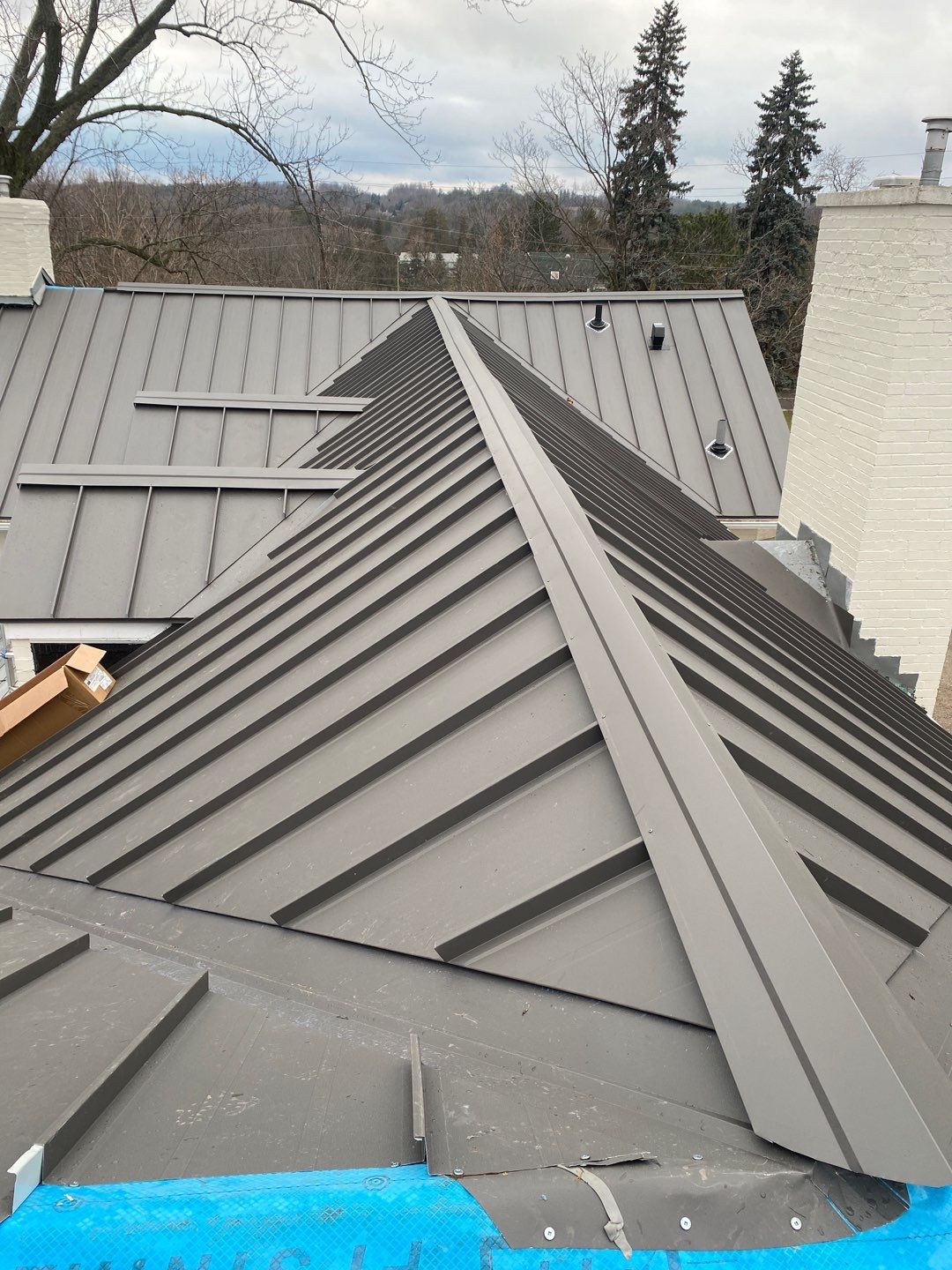 Residential Roofing Installation using 24 Ga Standing Seam Metal  by Jay Carter Roofing & Sheet Metal