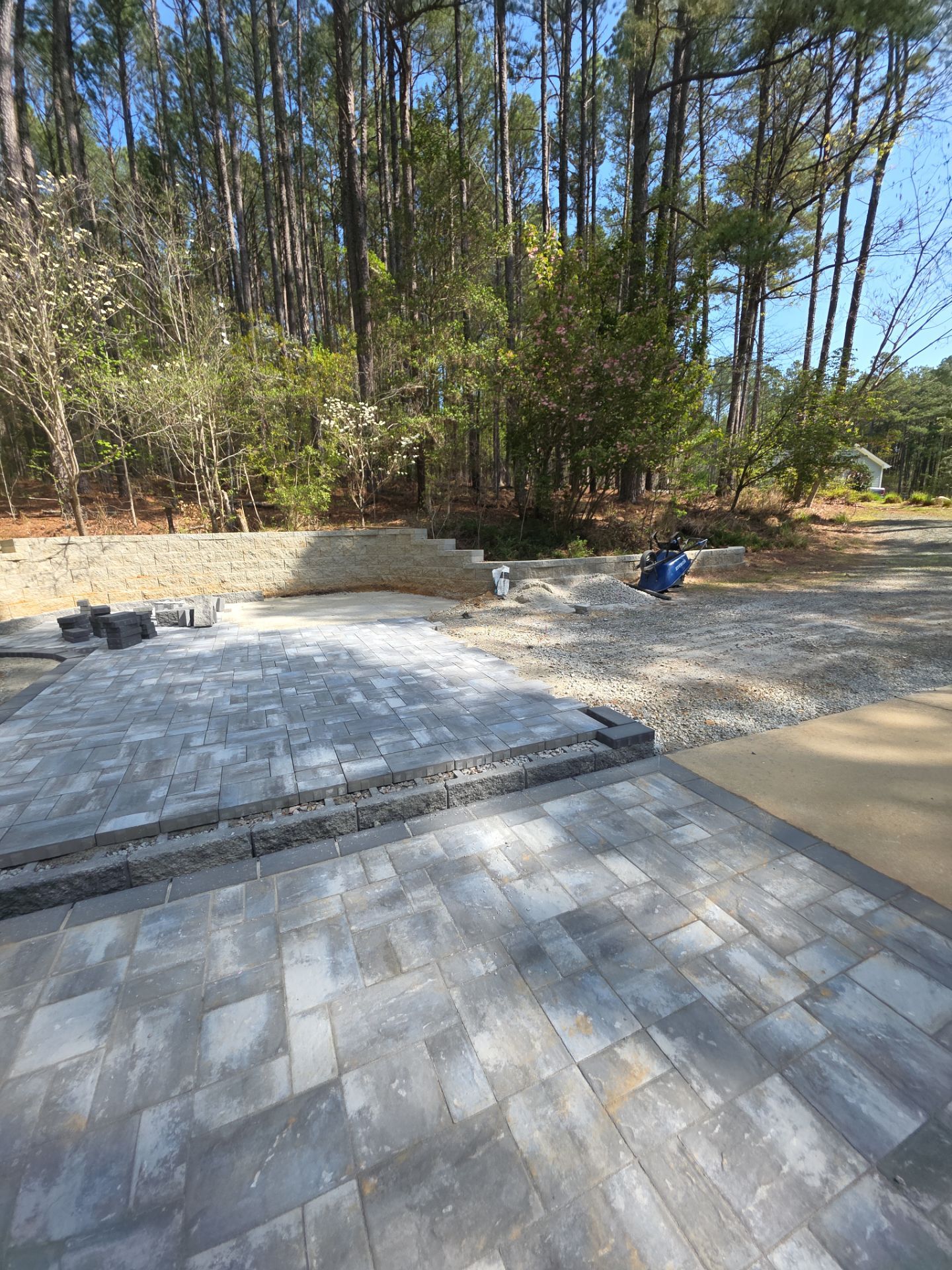 Pittsboro Outdoor Living Transformation – Retaining Wall, Paver Patio & Elevated Deck by Elite Remodeling and Design LLC