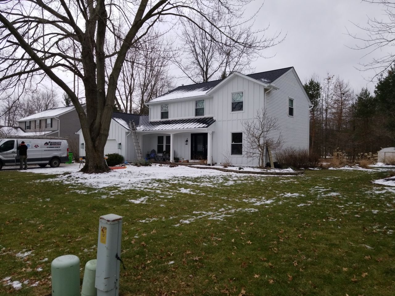 James Hardie Siding  using James Hardie Board and Batten, White by Absolute Roofing and Construction
