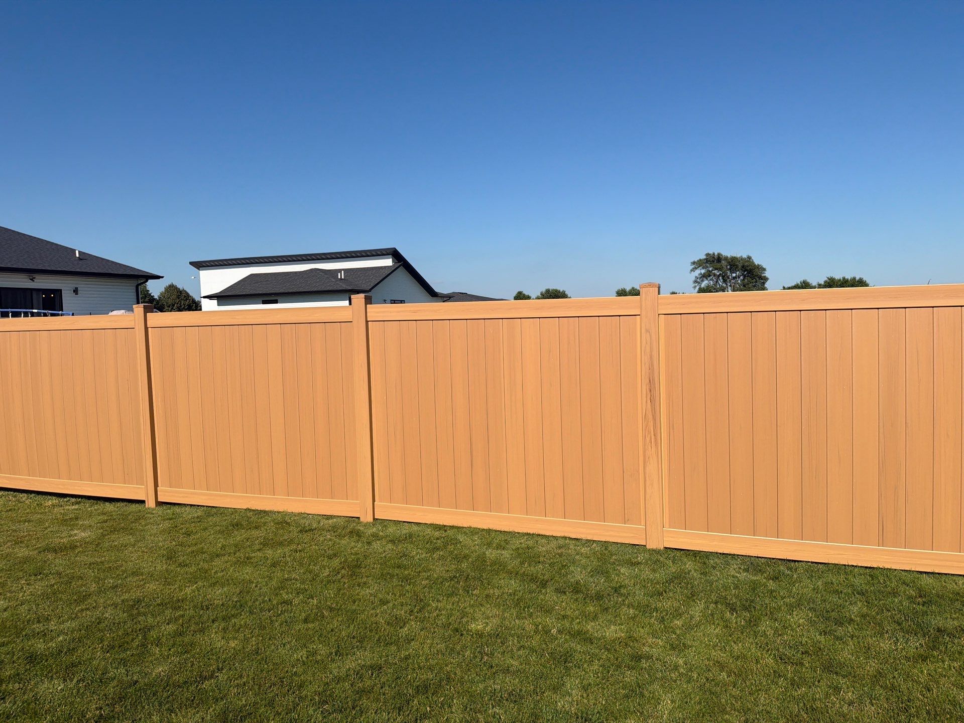 Residential Cypress Vinyl Privacy Fence Installation in Cedar Falls by Perfect Picket Fence and Stain