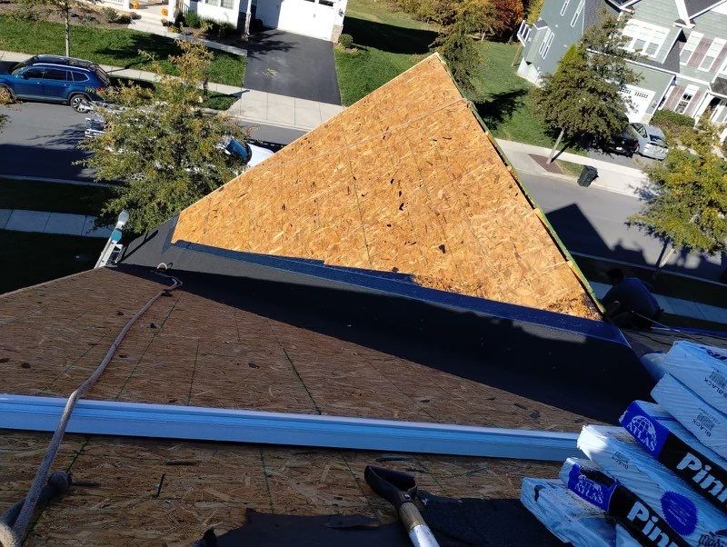 Residential Roofing Installation using Atlas Pinnacle Pristine Black Architectural Shingles by Frederick Roof Repair