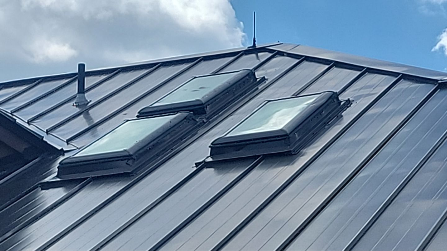 Standing Seam Metal Roof Replacement After Snow Damage by ASAP Roofing & Restoration