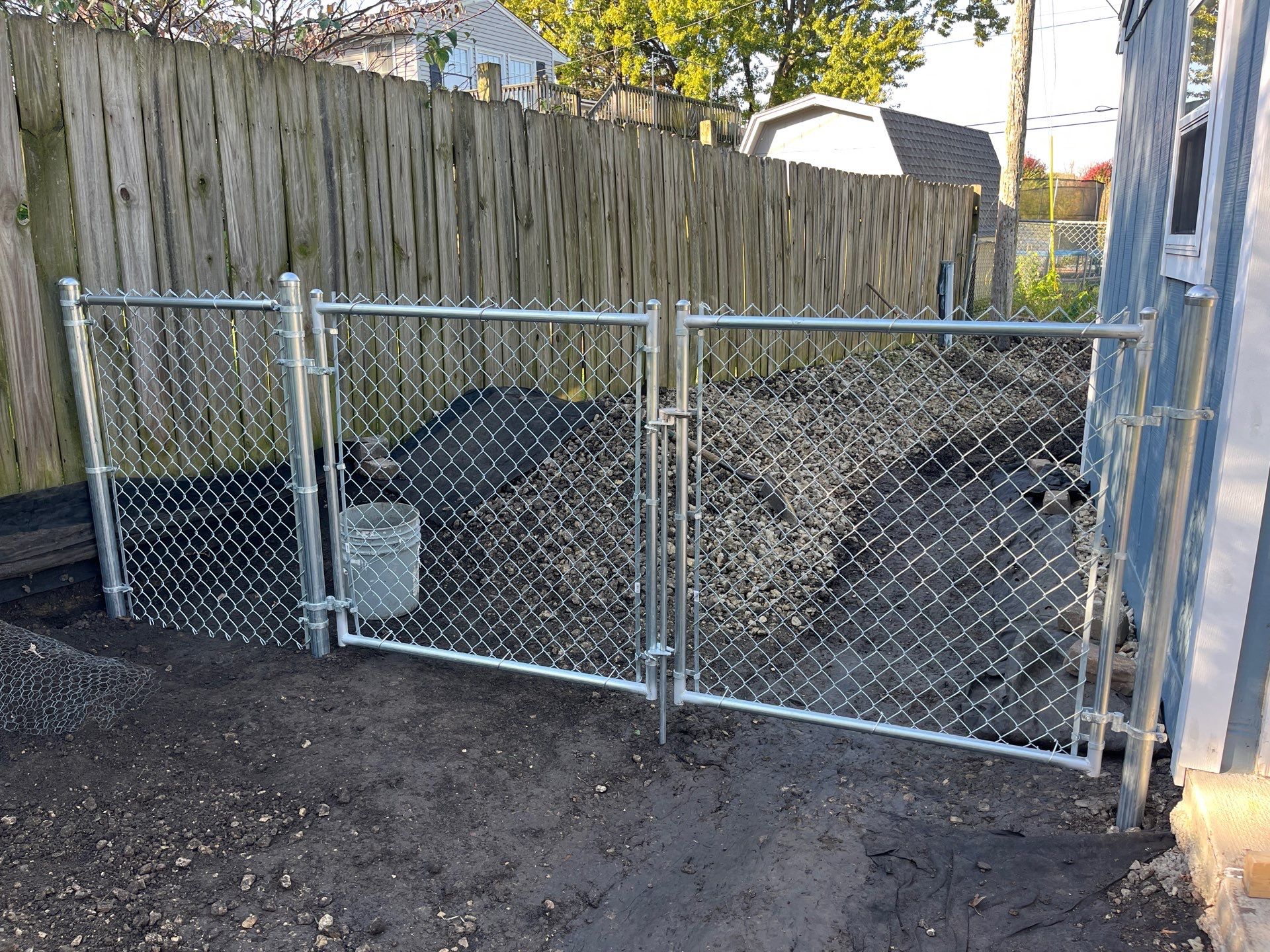 Chai Gray Vinyl Privacy Fence and Gate Installation in Cedar Falls by Perfect Picket Fence and Stain