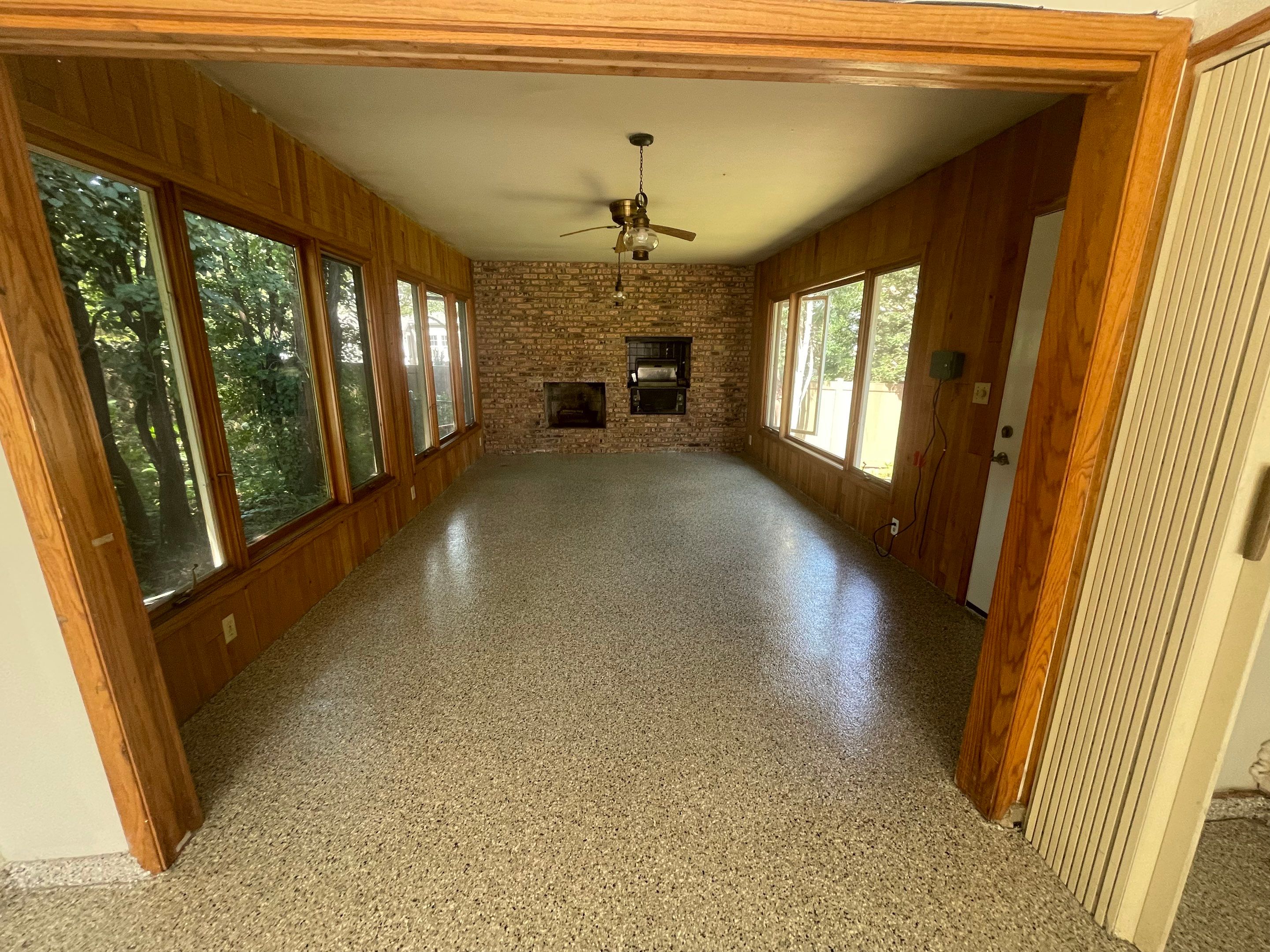 Sioux Falls Garage and Sunroom Concrete Coating with Coyote Flake by Select Painting, Coatings & Garage Cabinets