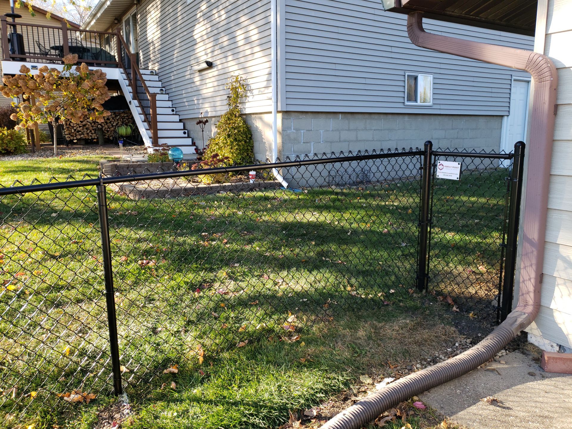 Black Chain Link Fence and Gate Installation in Cedar Falls by Perfect Picket Fence and Stain
