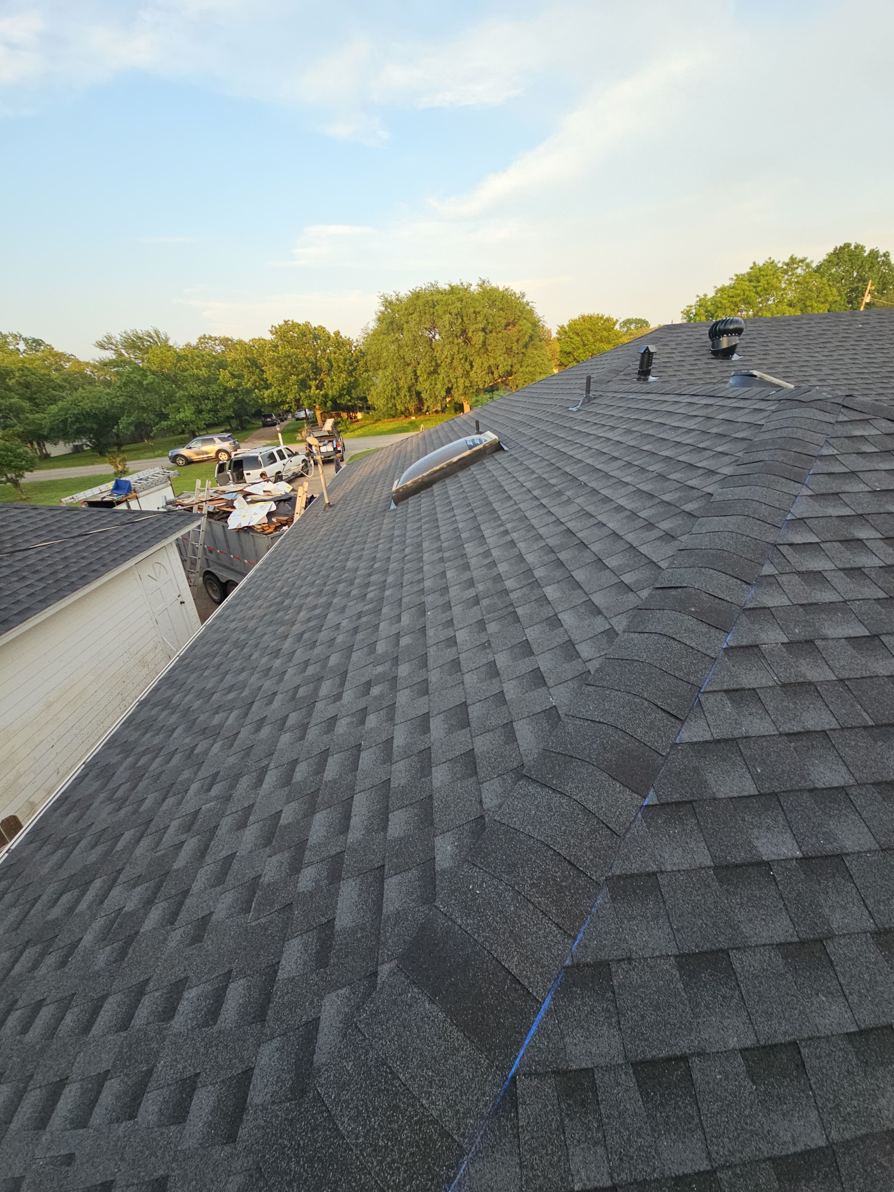 "Full Roof Replacement Due to Hail and Water Damage – Before & After" by road roofing llc