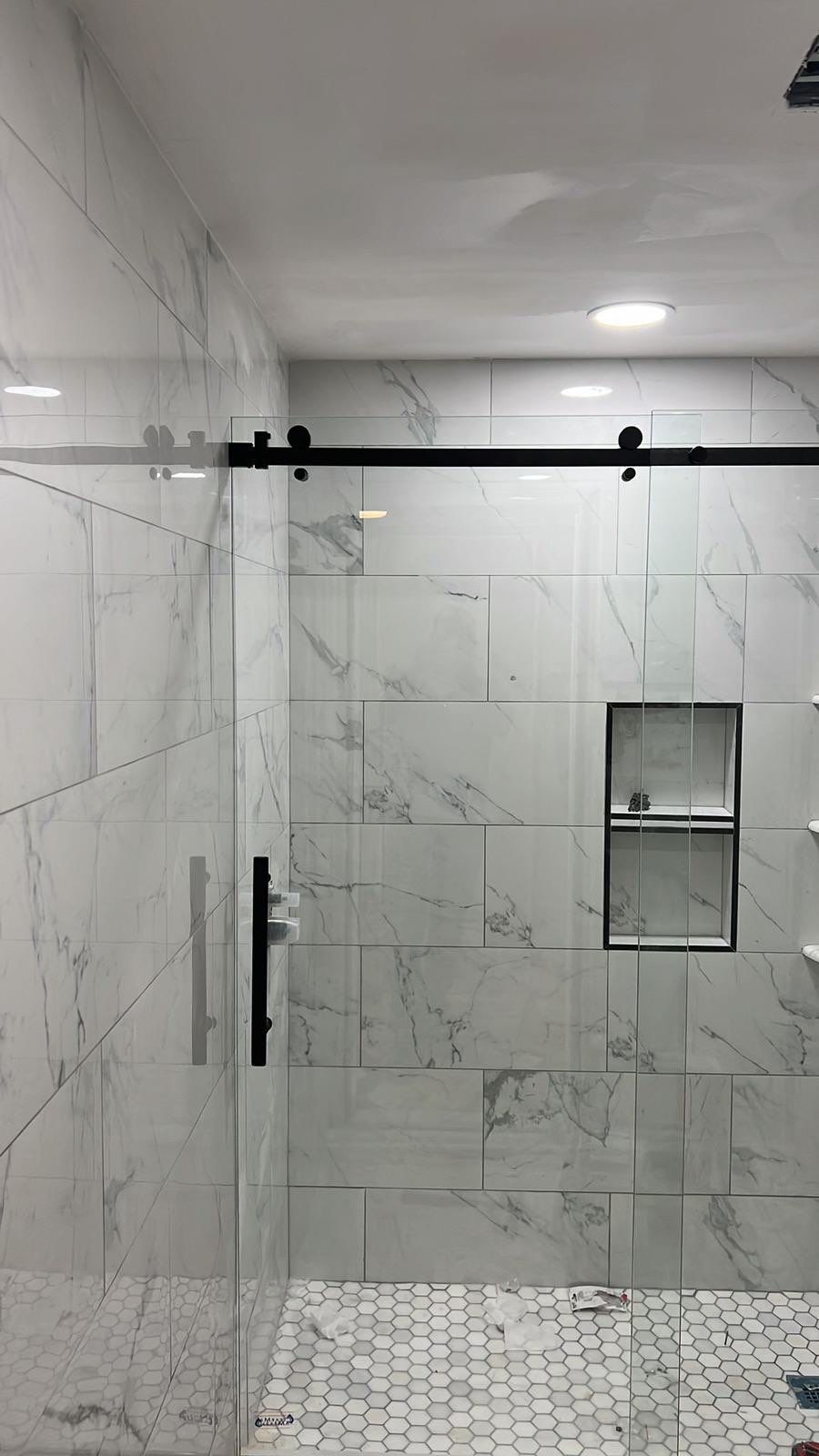 Bathroom Remodel using Tile by Home Concepts Construction
