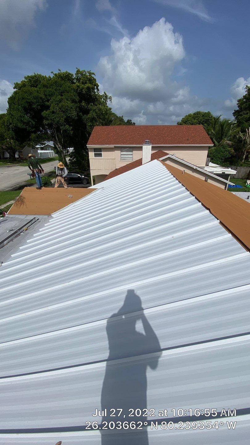 Residential Roofing Installation using 1.5" Nail Strip 24ga Solar White Kynar Coated Standing Seam Metal Panels by Morton Roofing, Inc.