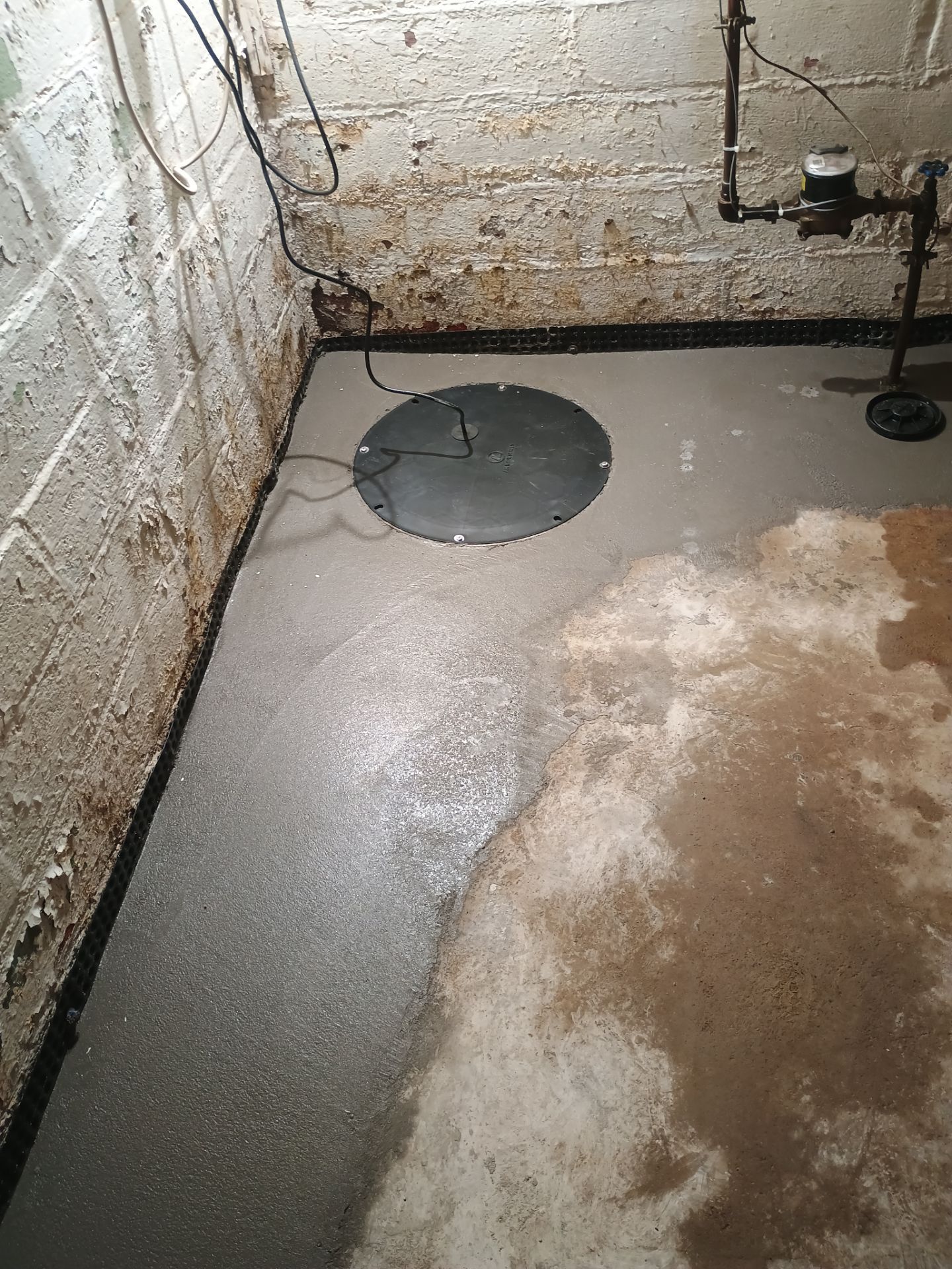 Interior Drain Tile & Sump Pump System in North Minneapolis by Waterproofing Northeast