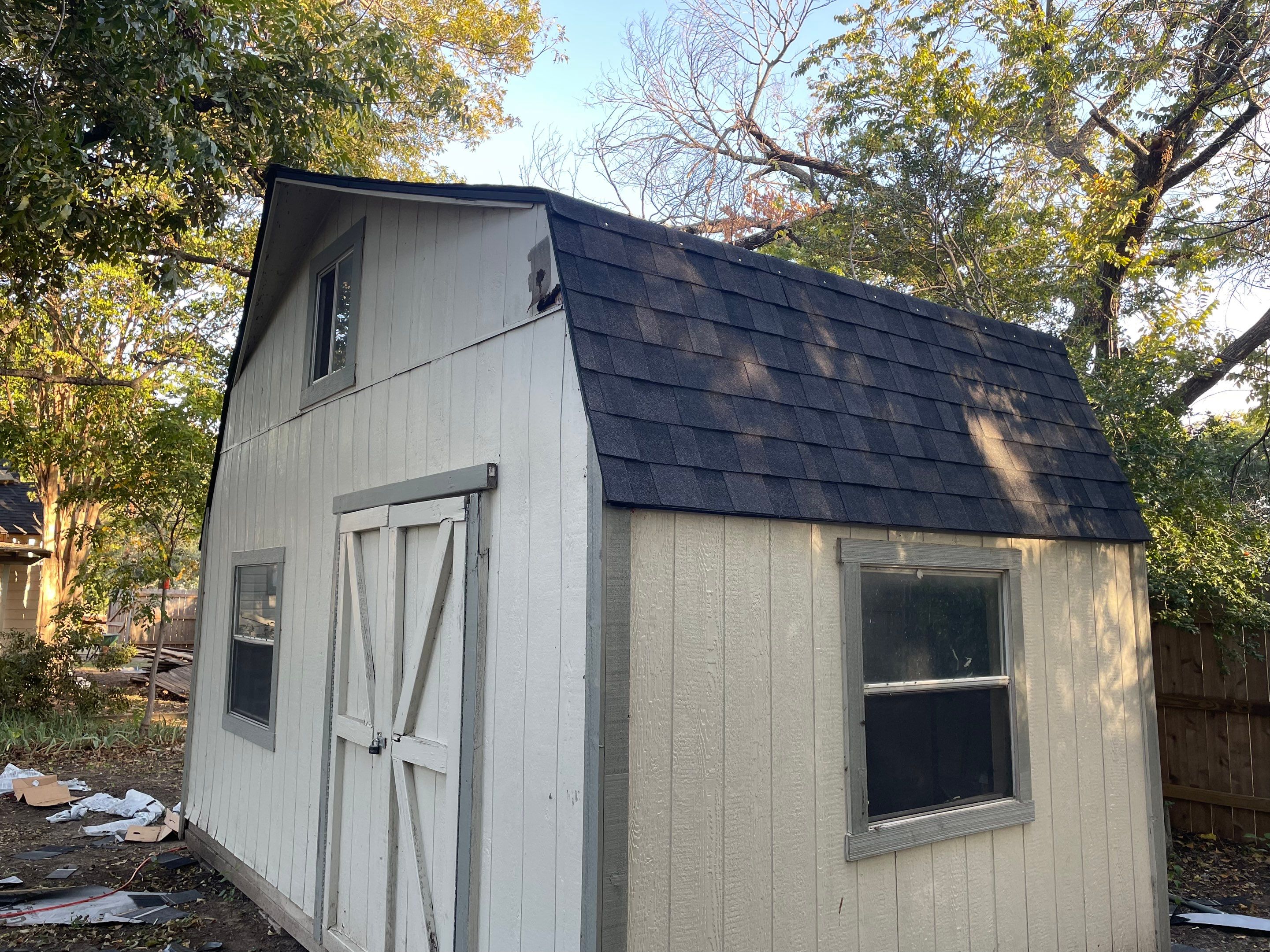 White exterior with IKO Glacier by Tejas Roofworks + Restoration